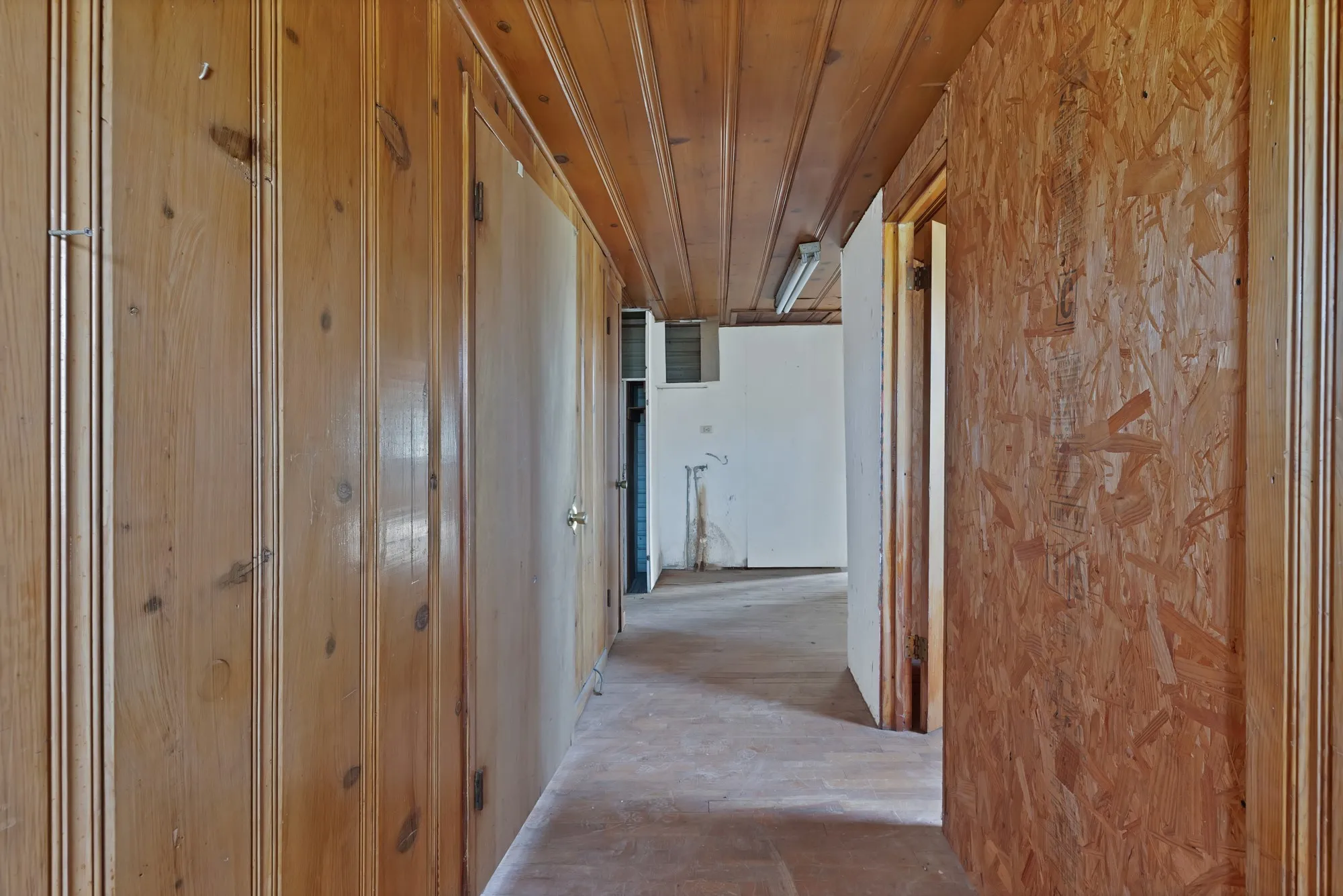 Hallway with wood ceiling