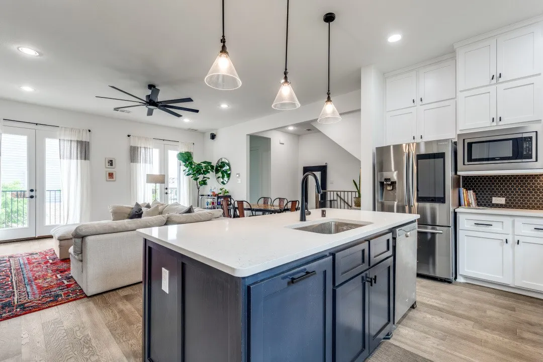 Kitchen overlooking dining and living.