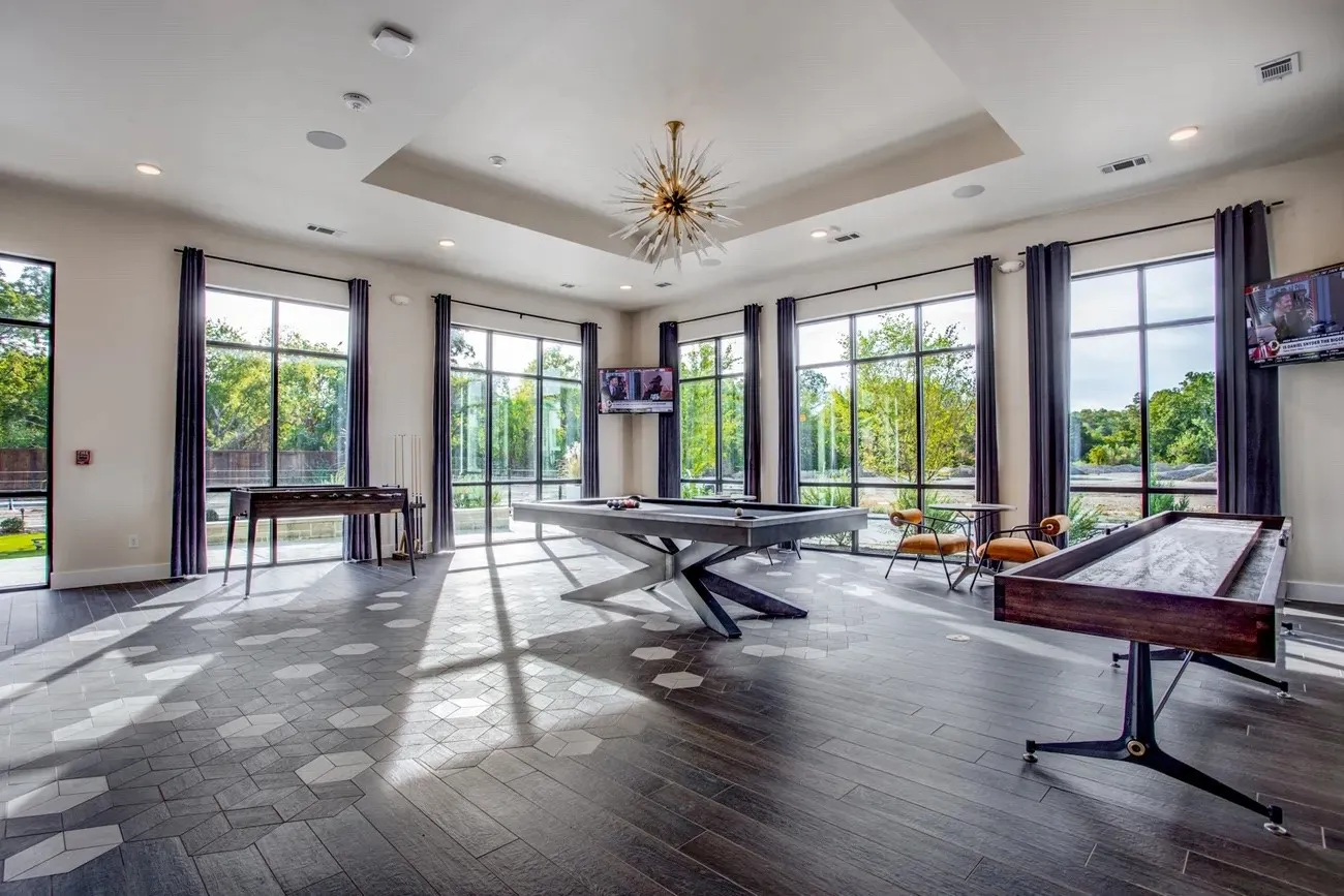 Alternate game room with golf simulator.