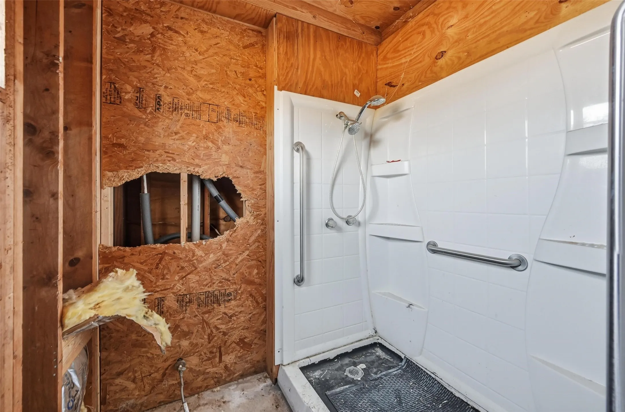 Full bathroom with a shower stall