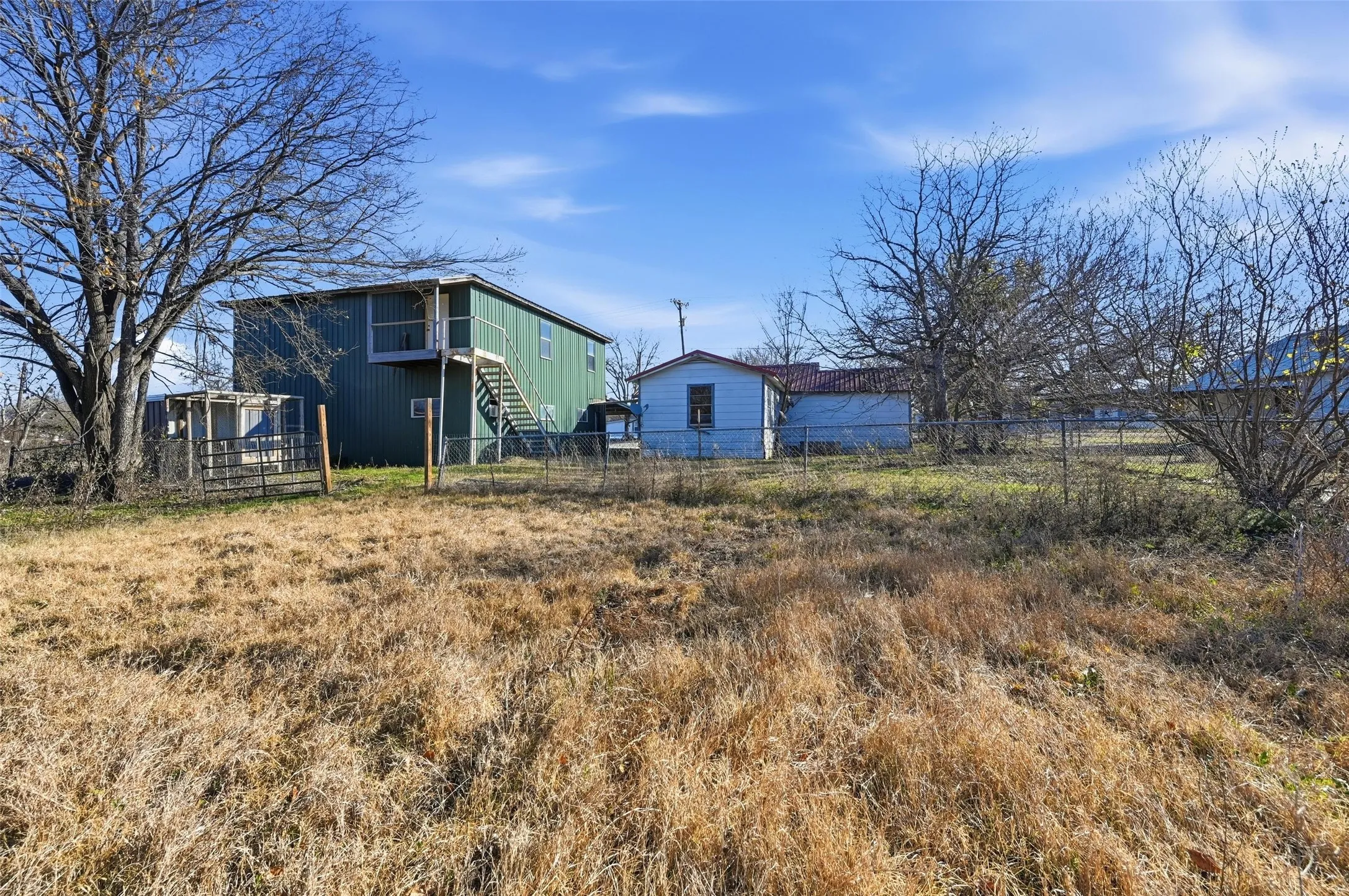 Fenced yard featuring stairs