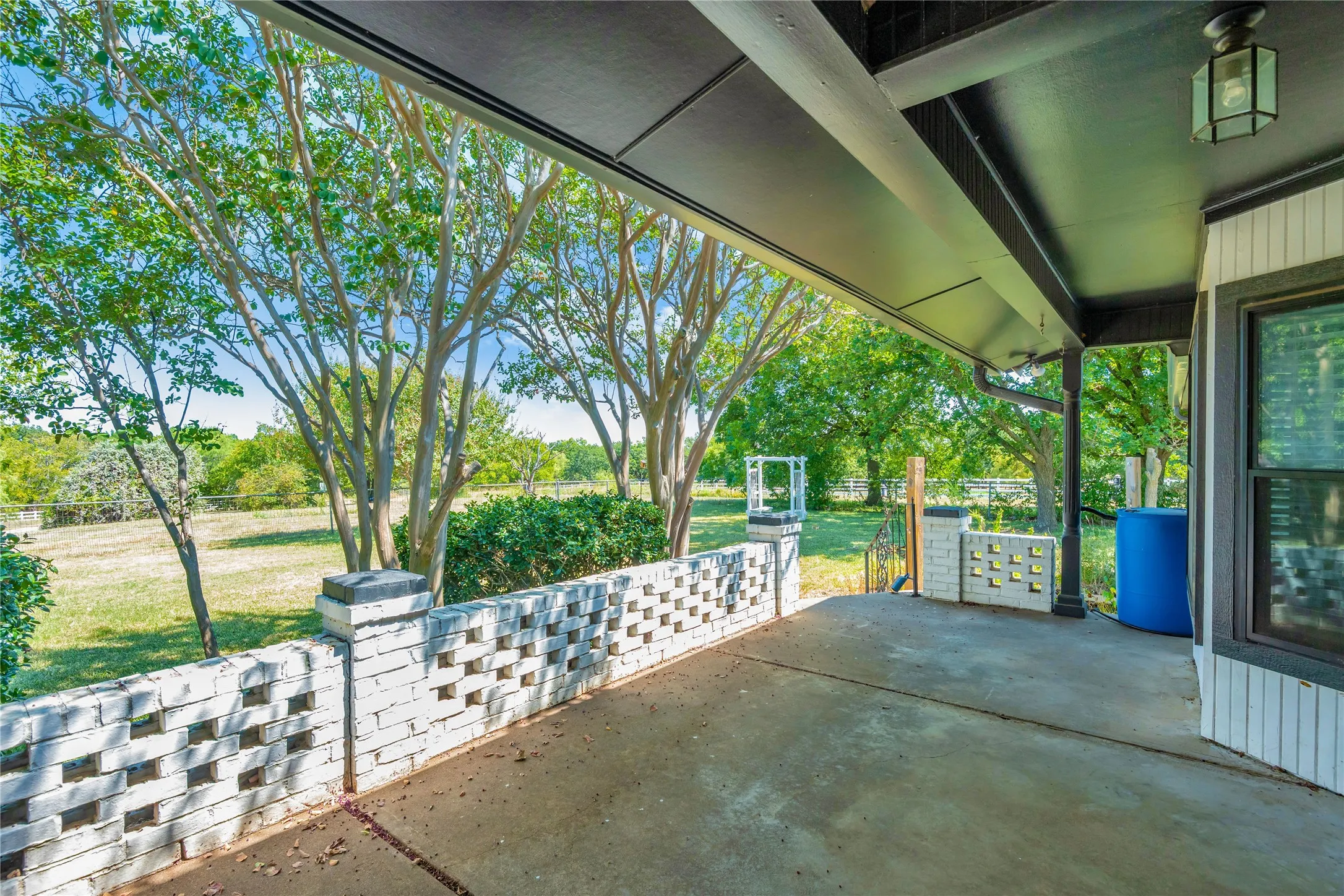 Covered outdoor patio with a concrete surface