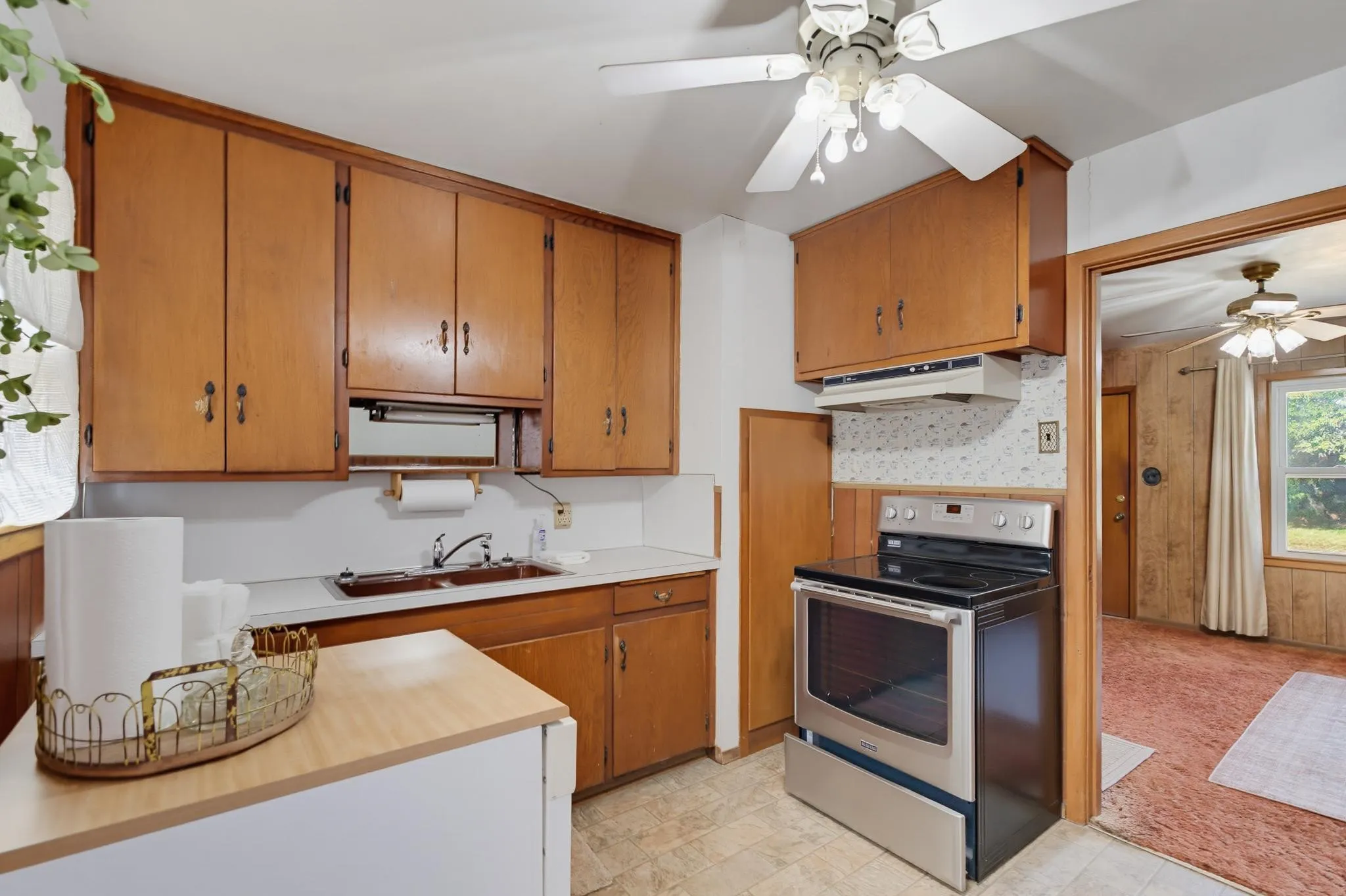 Nice wood cabinets and range.