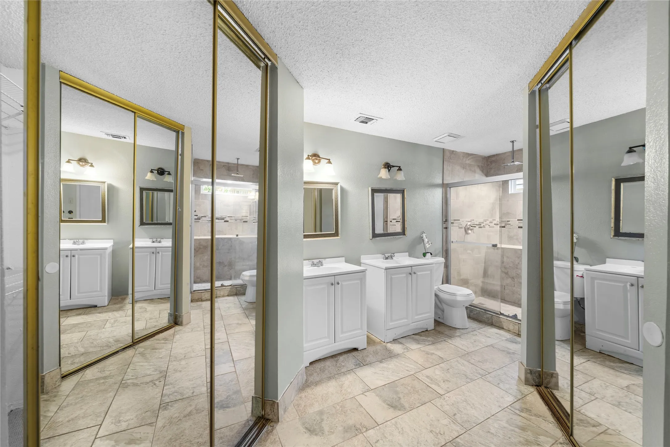 Double vanity with white cabinetry and integrated sinks