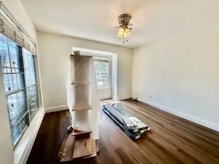  featuring luxury vinyl wood look finished floors and ceiling fan new blinds