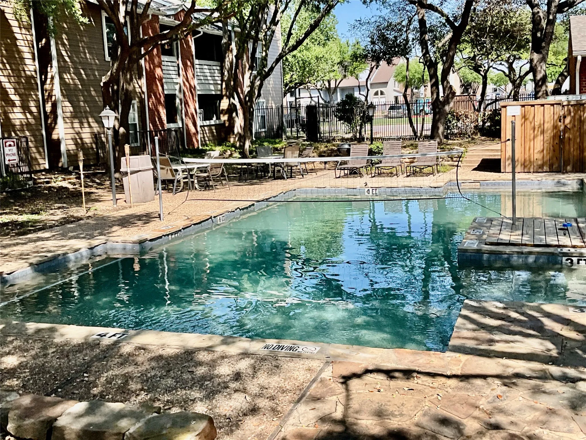 Community pool with a patio area