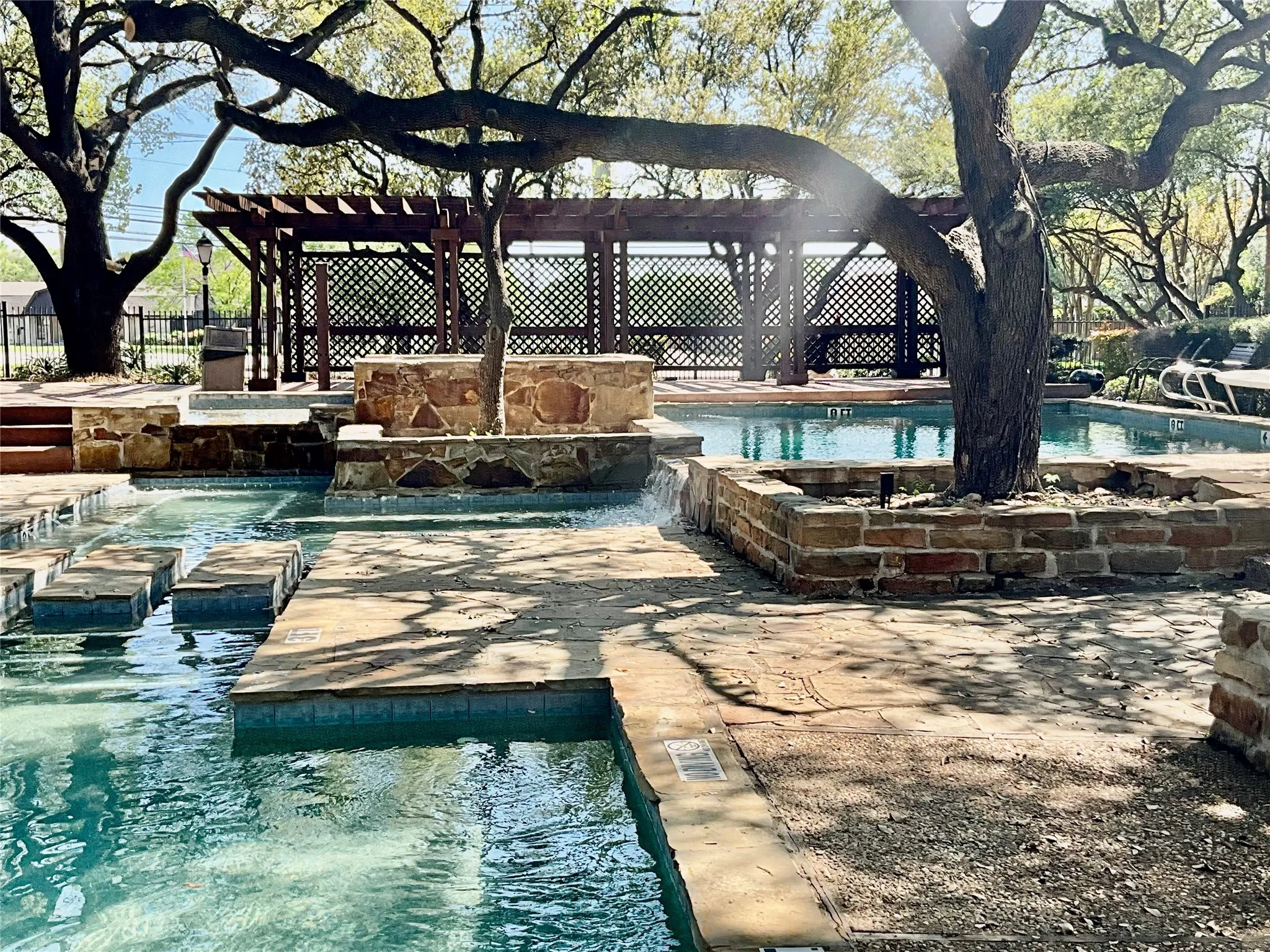 Community pool with a hot tub