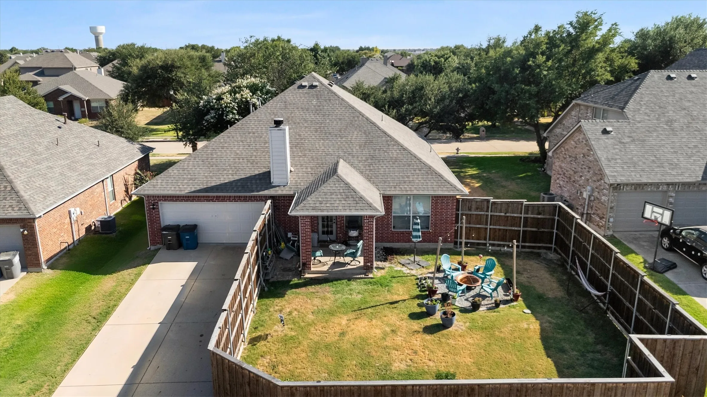 Brick exterior with a gabled roof and a rear patio