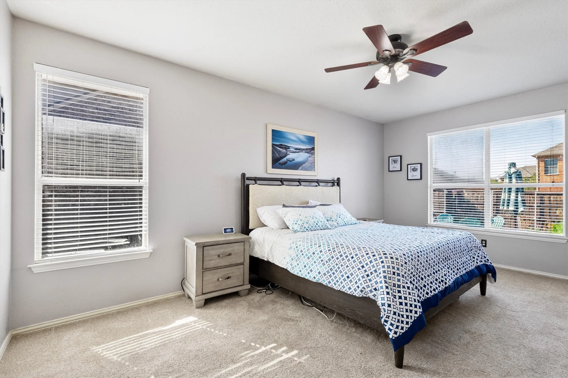 Neutral-toned walls complement the carpeted flooring