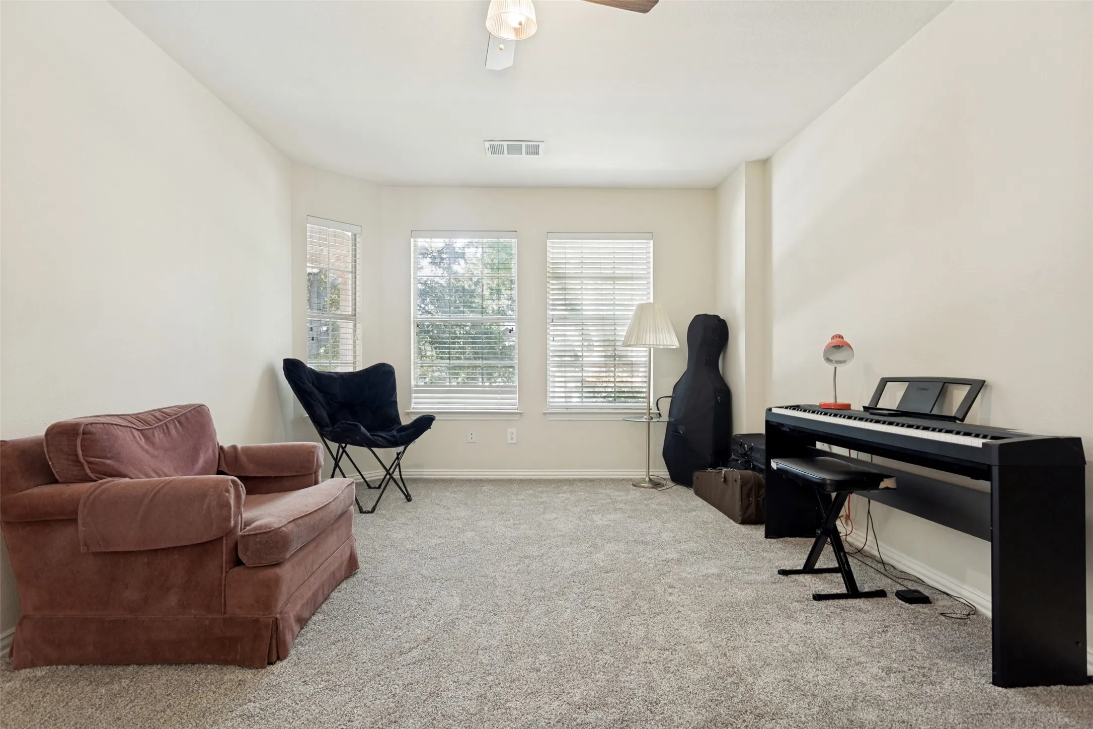 Large secondary bedroom upstairs can be a flex space if 5 bedrooms are not needed.  Oversized closet opens to finished out attic space