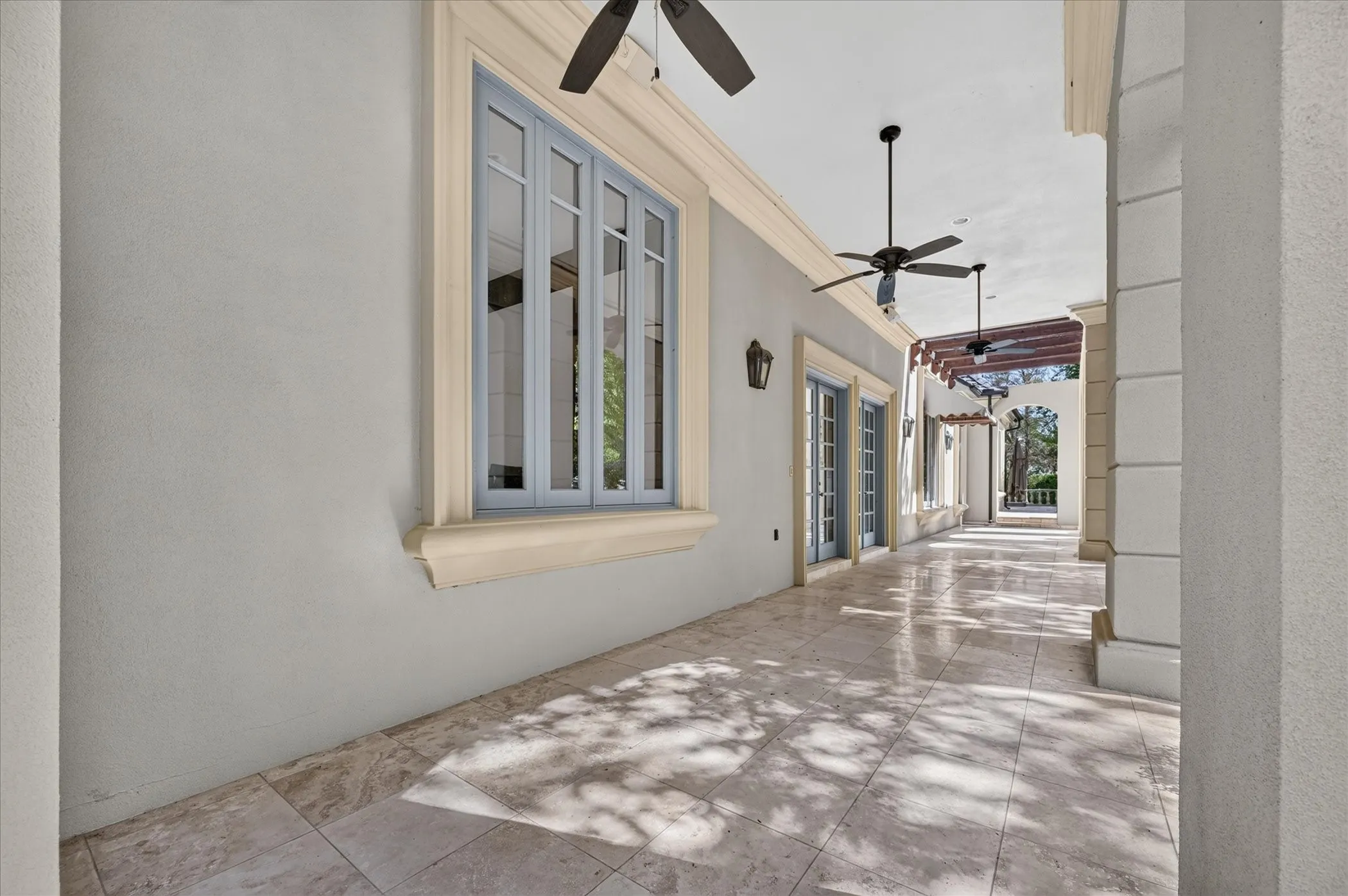 Outdoor living is equally impressive with an enormous covered patio