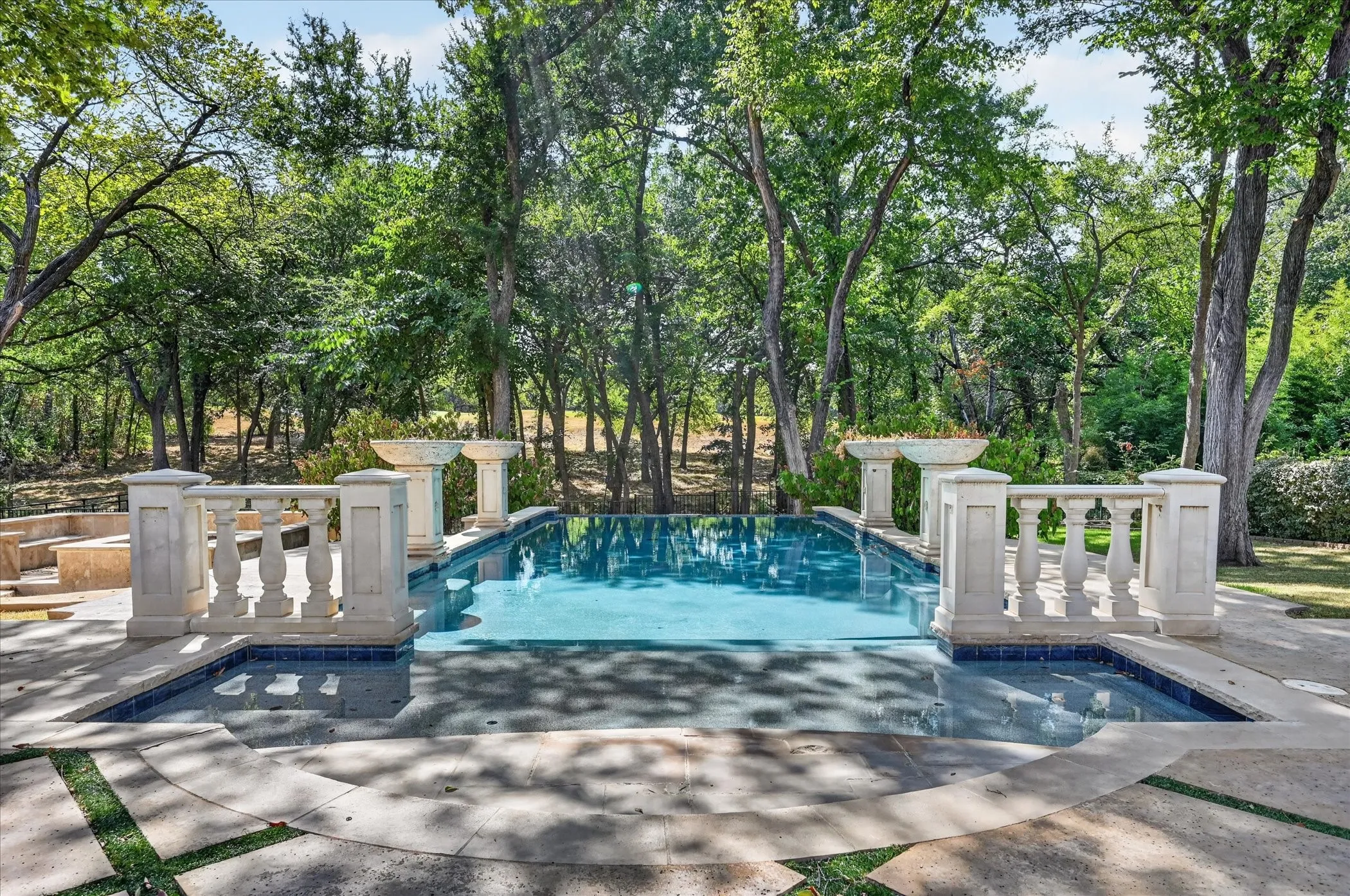 Unwind in the sparkling infinity-edge pool with separate spa