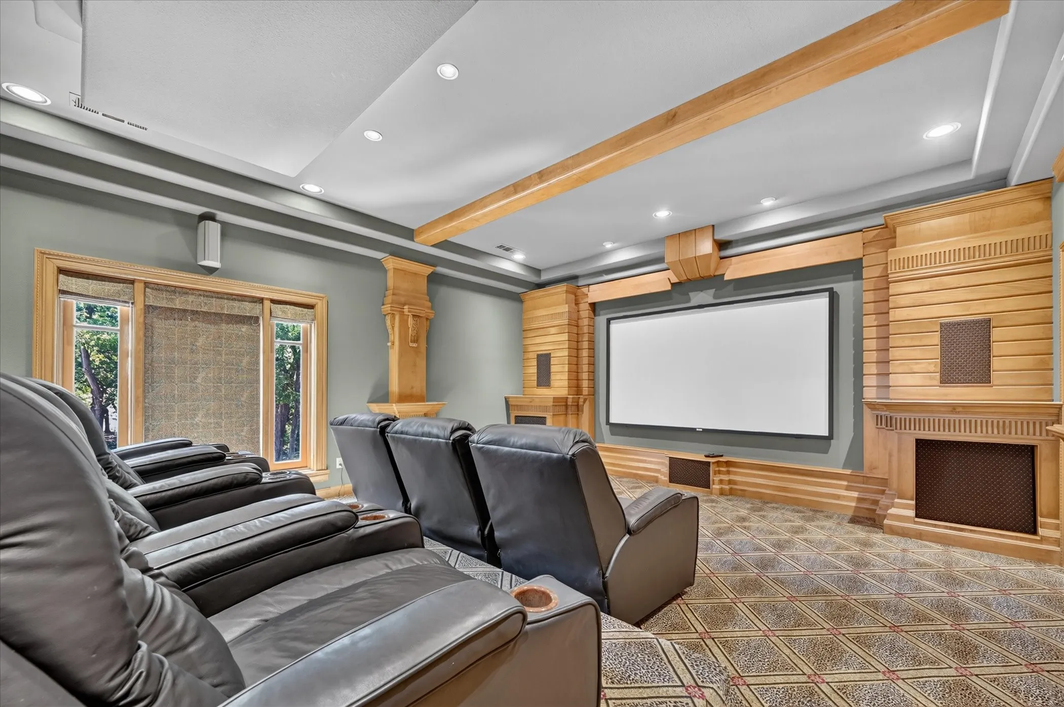 Entertain in the high-tech media room with projector and surround sound