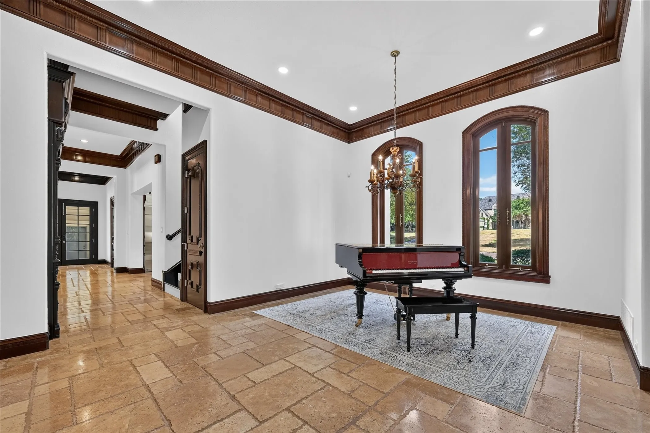Distinctive architectural details continue throughout with coffered ceilings, exposed wood beams, intricate moldings, art niches, and decorative columns.