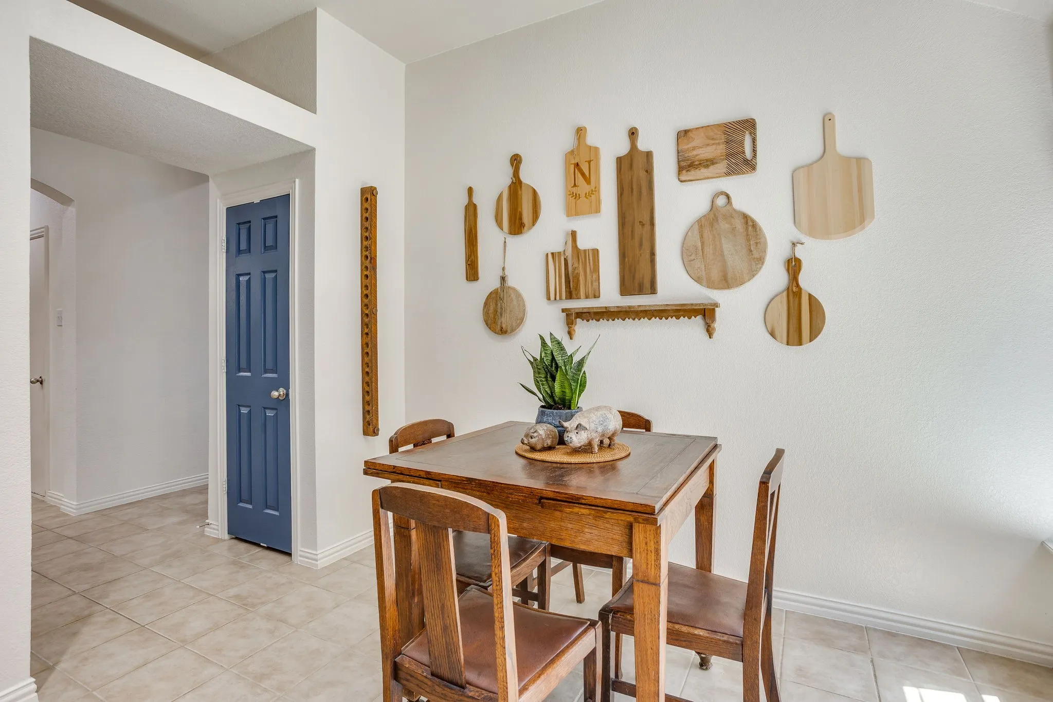 Recessed wall niche, white baseboards, and tiled flooring