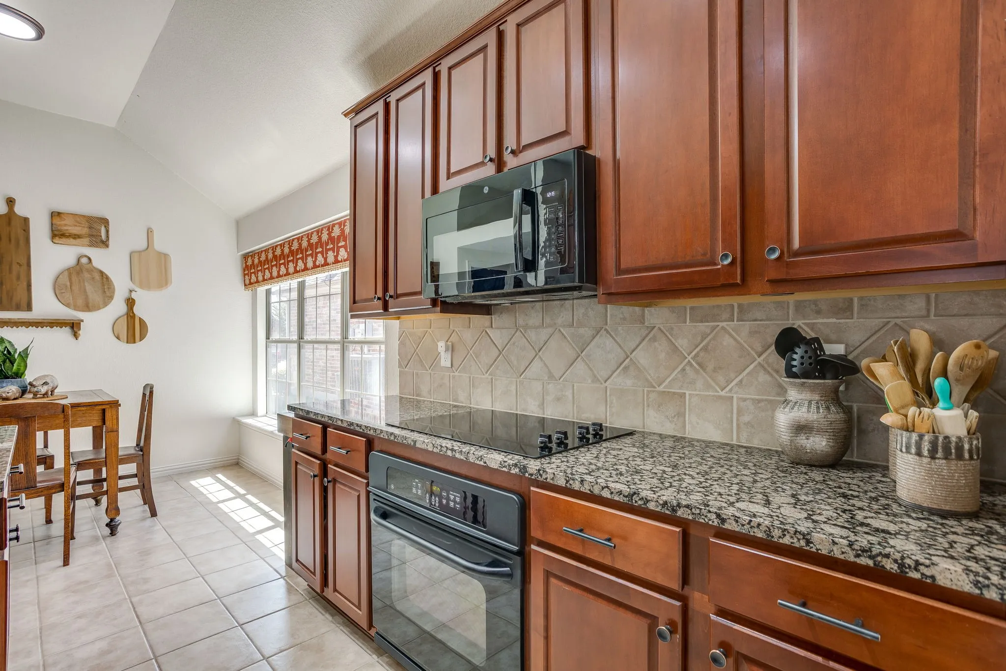 Wood-finish cabinetry paired with a solid surface countertop