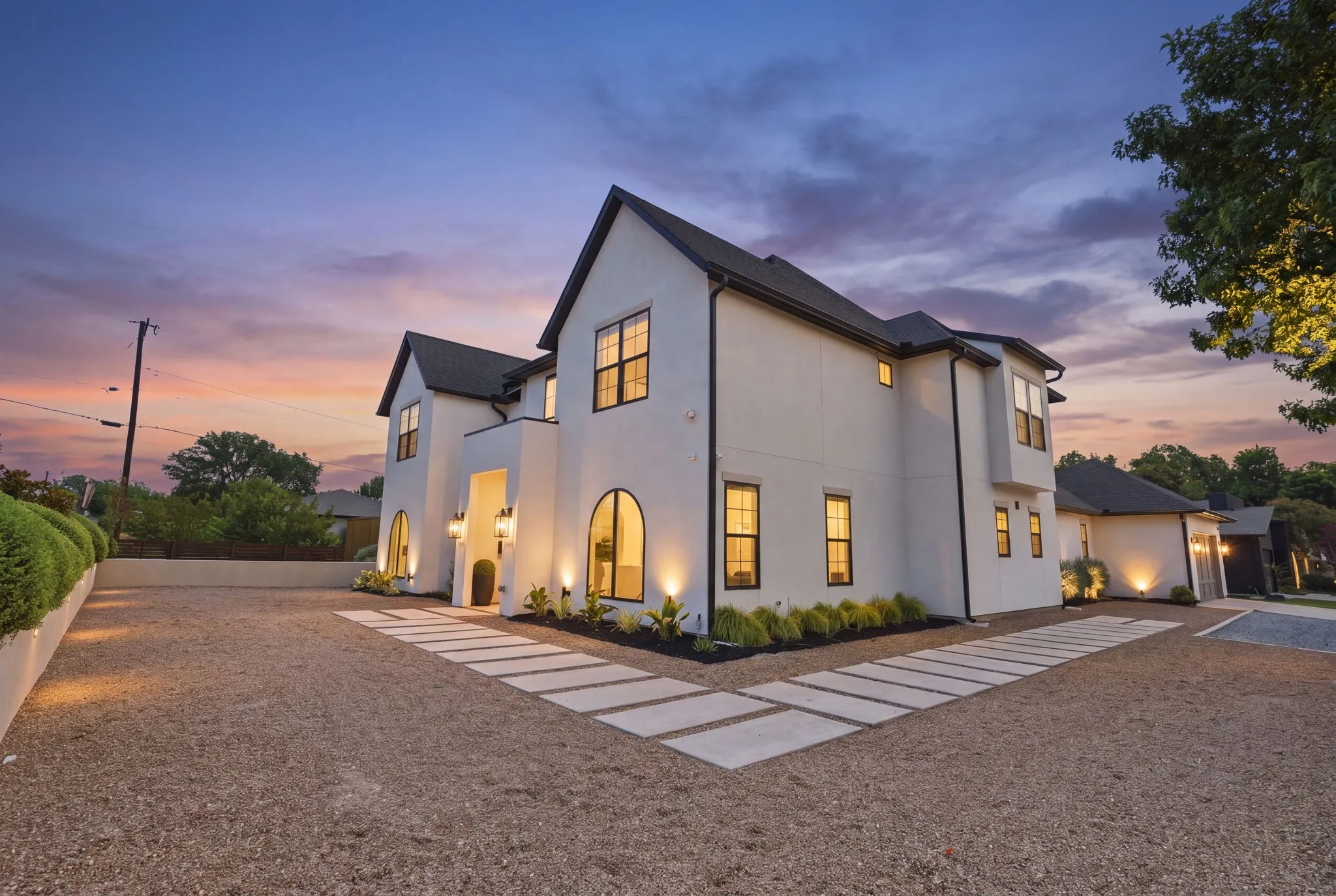 Contemporary residence featuring a private pool, extensive hardscaping, and a lush lawn