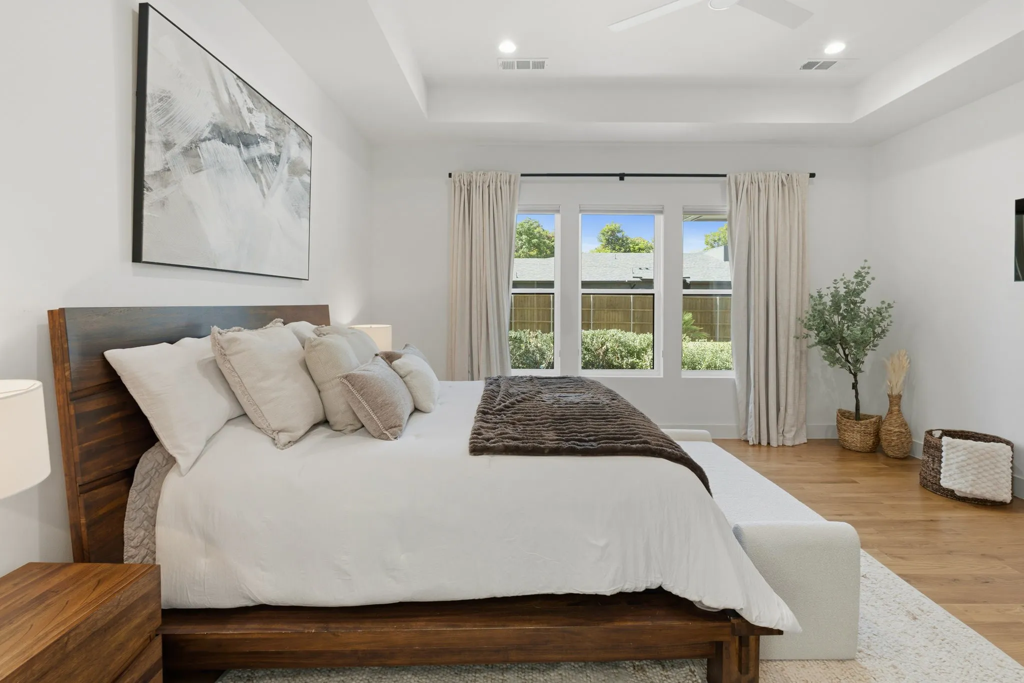 Tray ceiling with recessed lighting and a ceiling fan