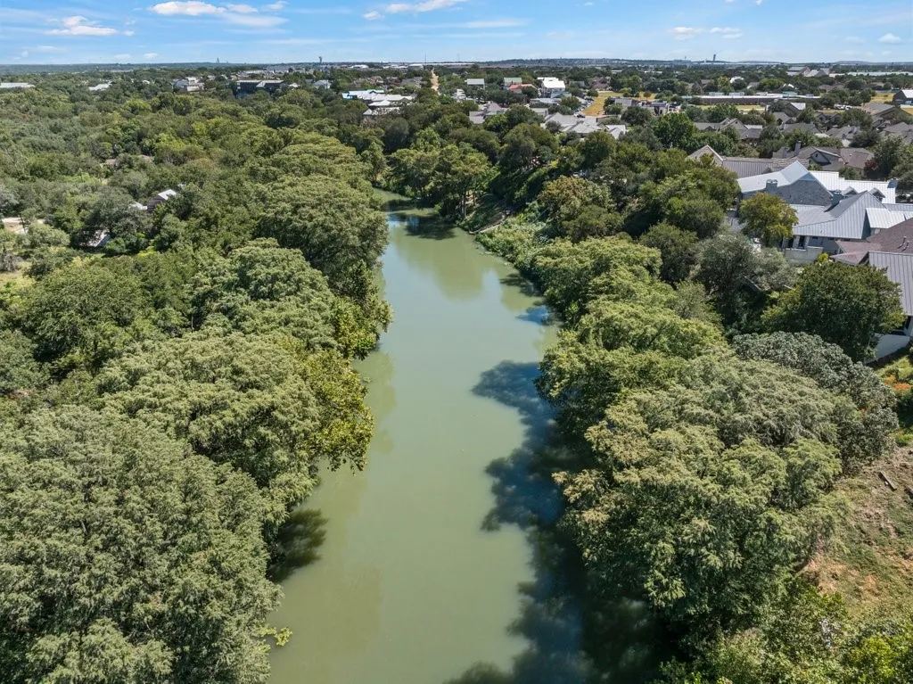 Riverfront property featuring extensive mature tree coverage