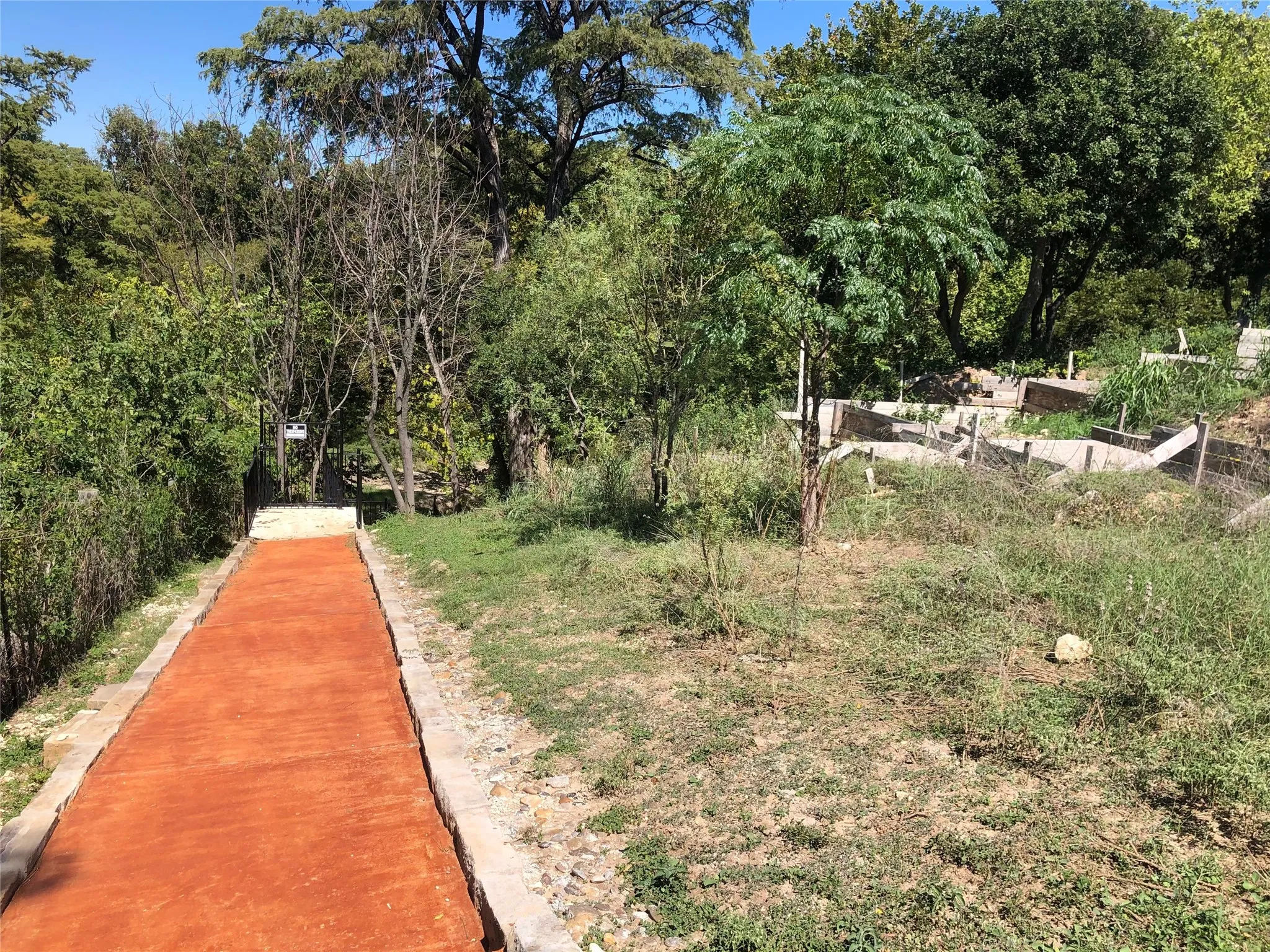 Terraced landscaping with established trees and a defined pathway