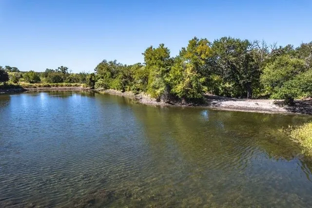 Enjoy the permanent pond of this lot