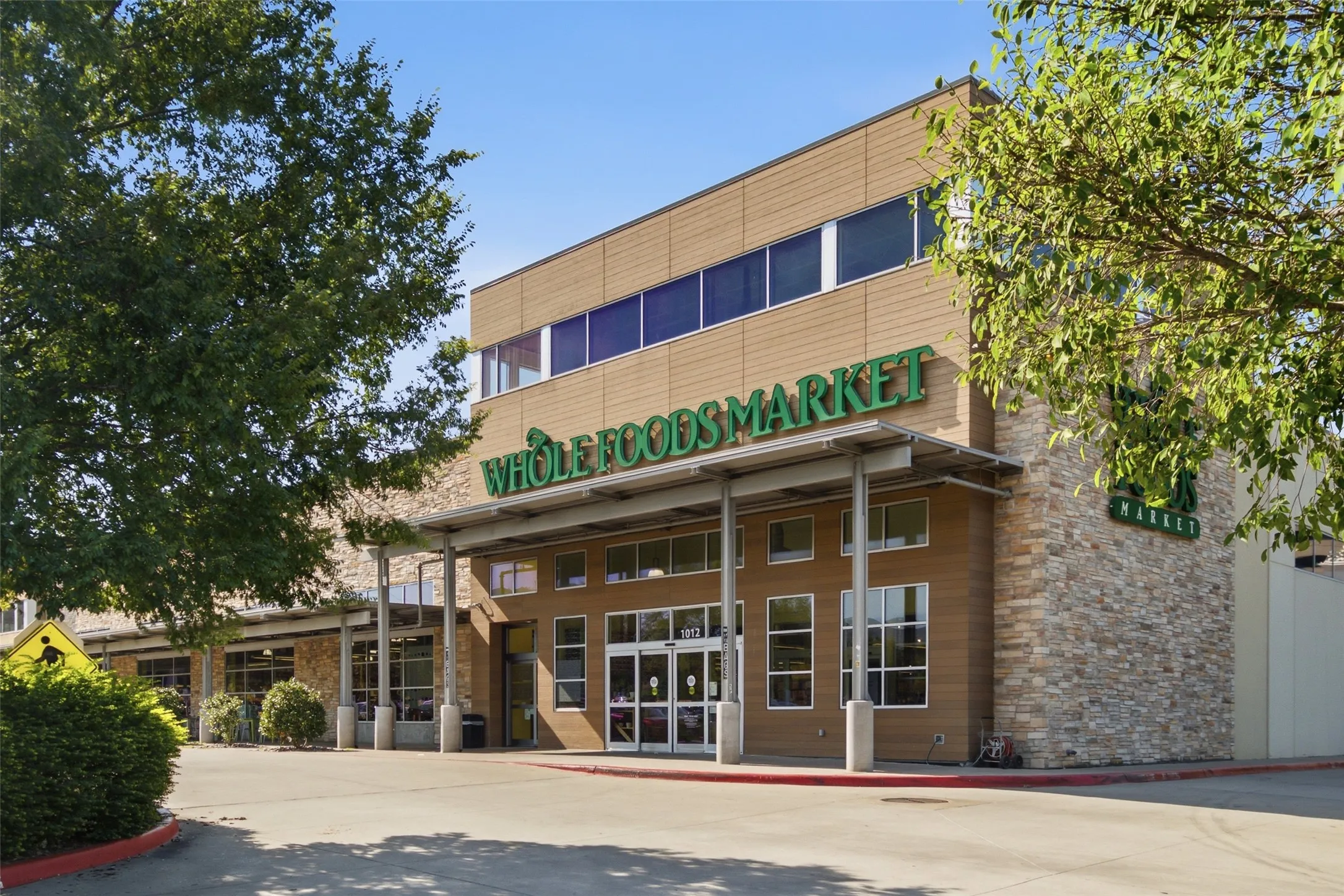Whole Foods Market is just minutes away — a convenient anchor for everyday errands and one of the many walkable amenities this location offers.