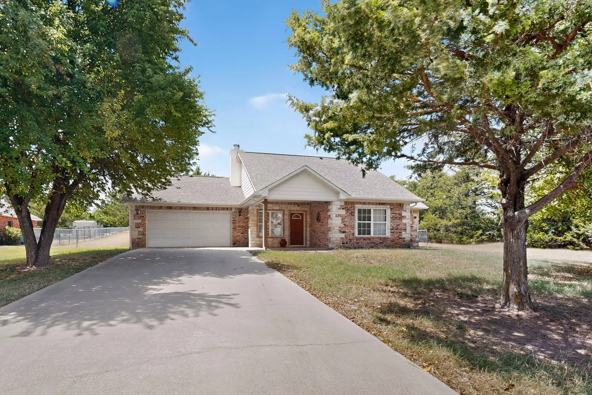 Brick and siding exterior with a gabled roof