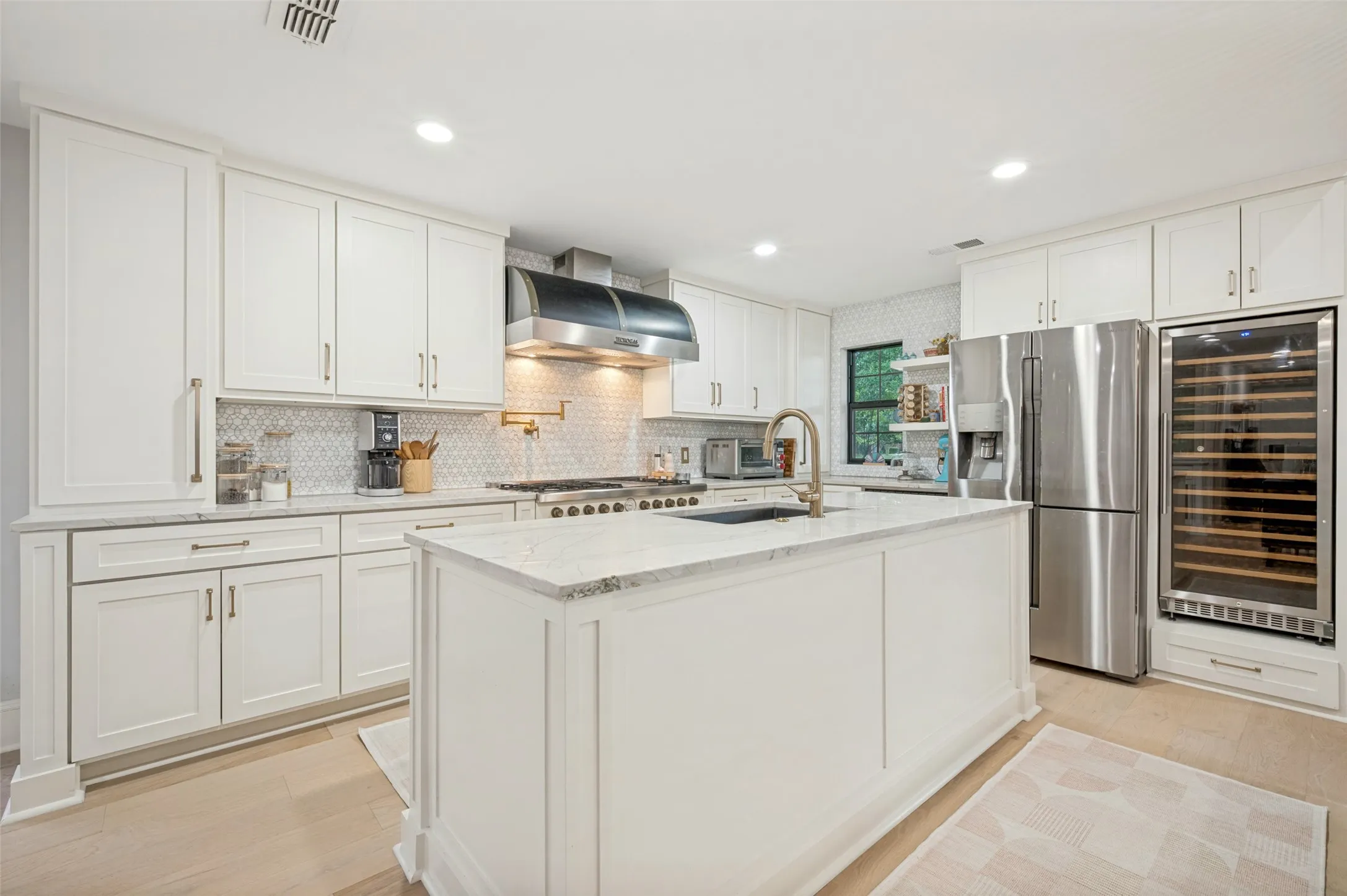 Quartzite countertops, built-in wine refrigerator