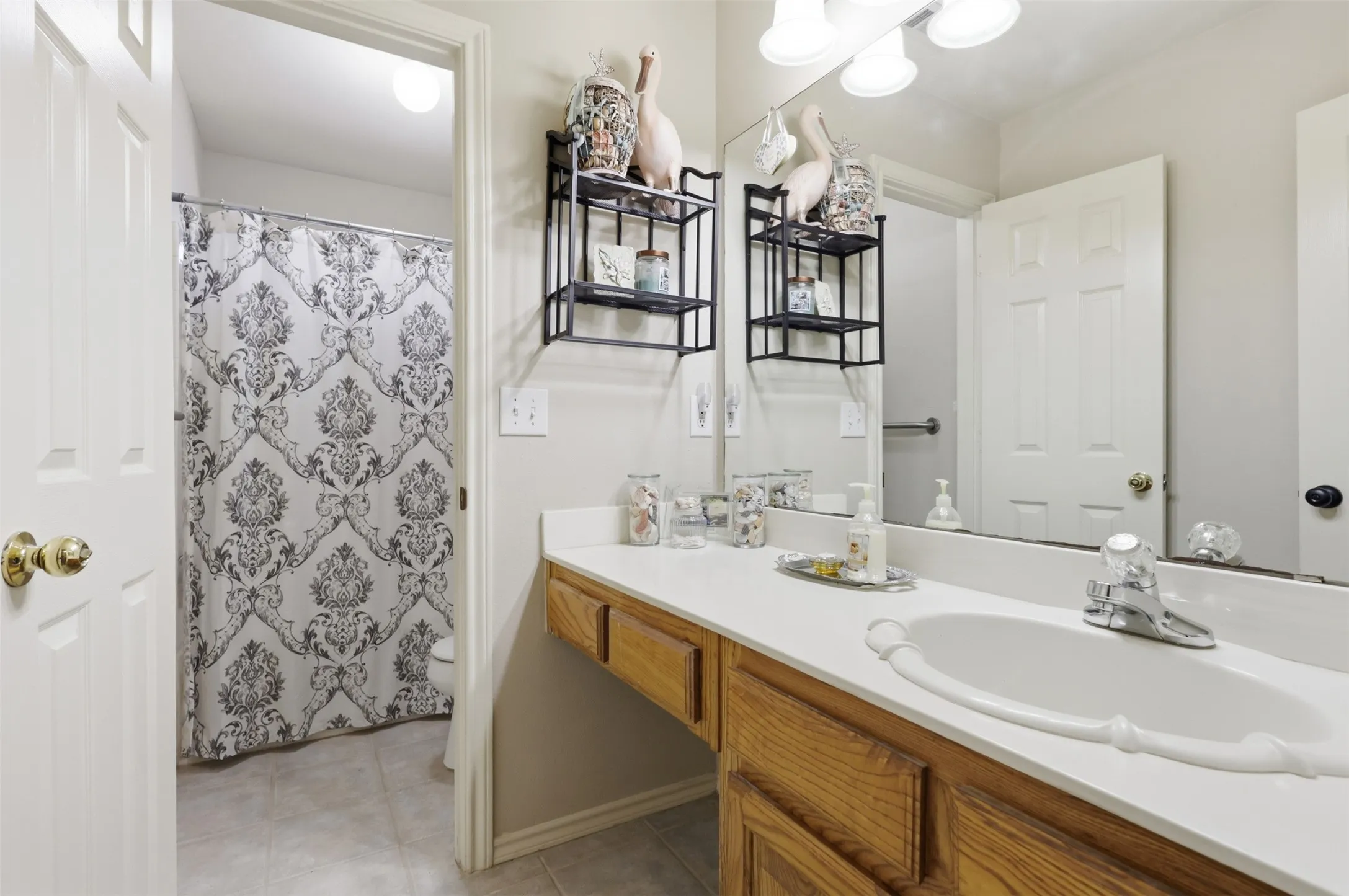 Secondary bathroom has private shower/tub area.