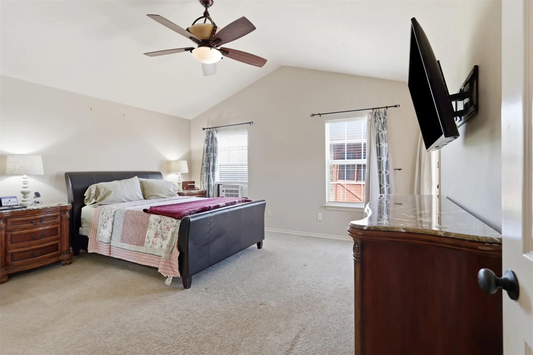 Large primary bedroom is on a separate hallway with walk-in closet and en-suite bathroom.
