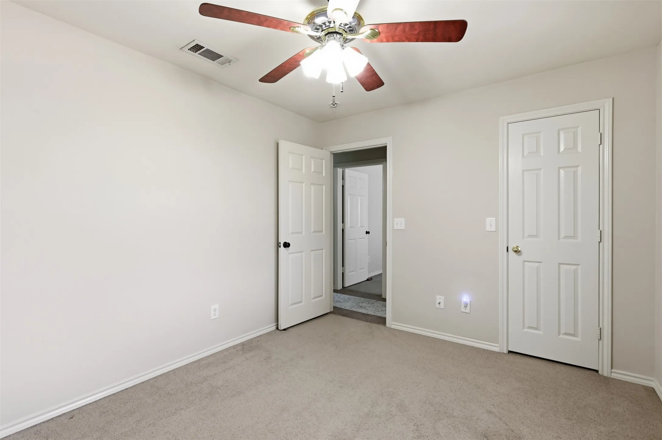 Alternate view of third bedroom looking towards hallway.