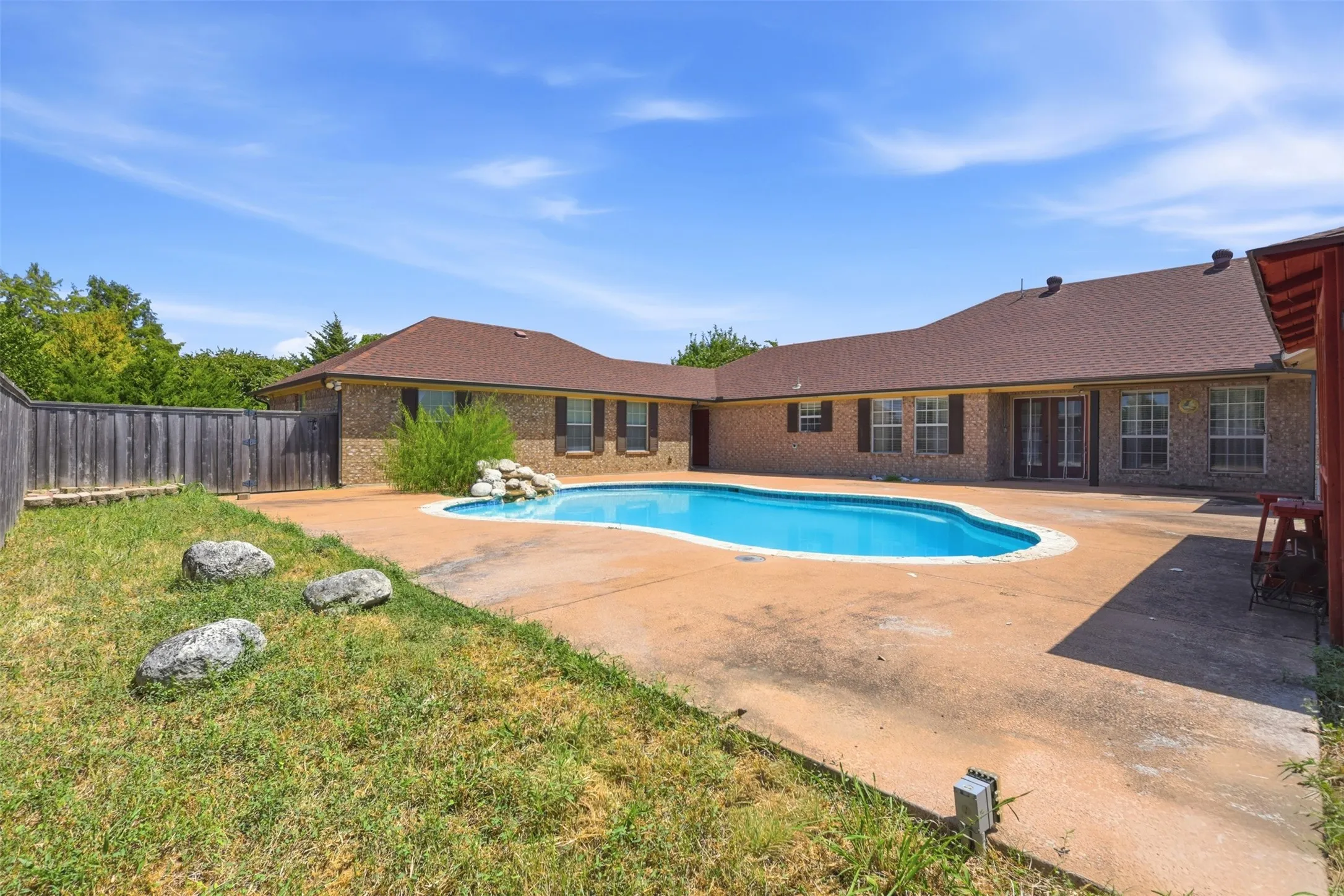 Alternate view of pool looking towards house and water feature.