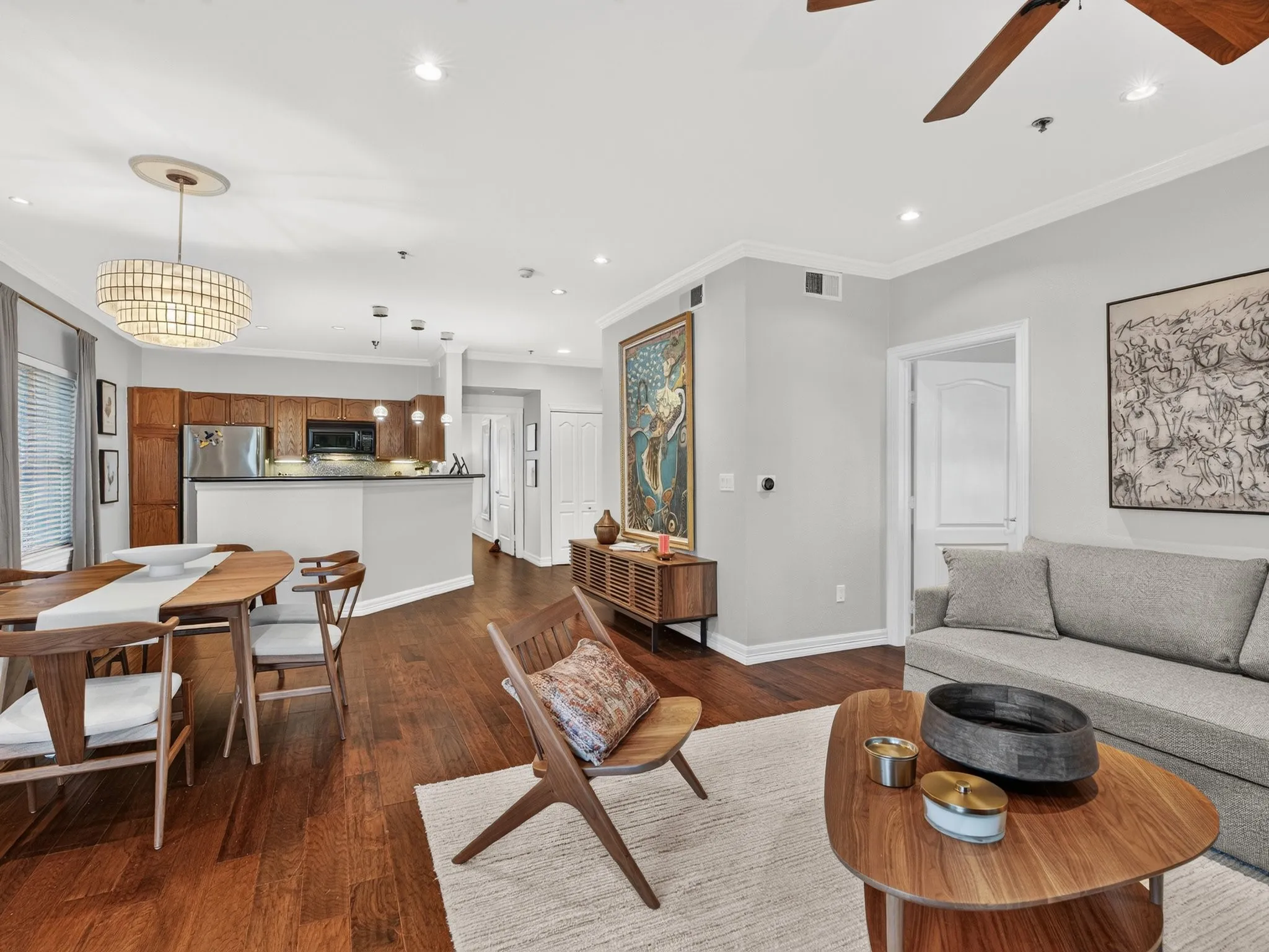 Hardwood flooring, crown molding, recessed lighting, wood-finish cabinetry, and stainless steel appliances