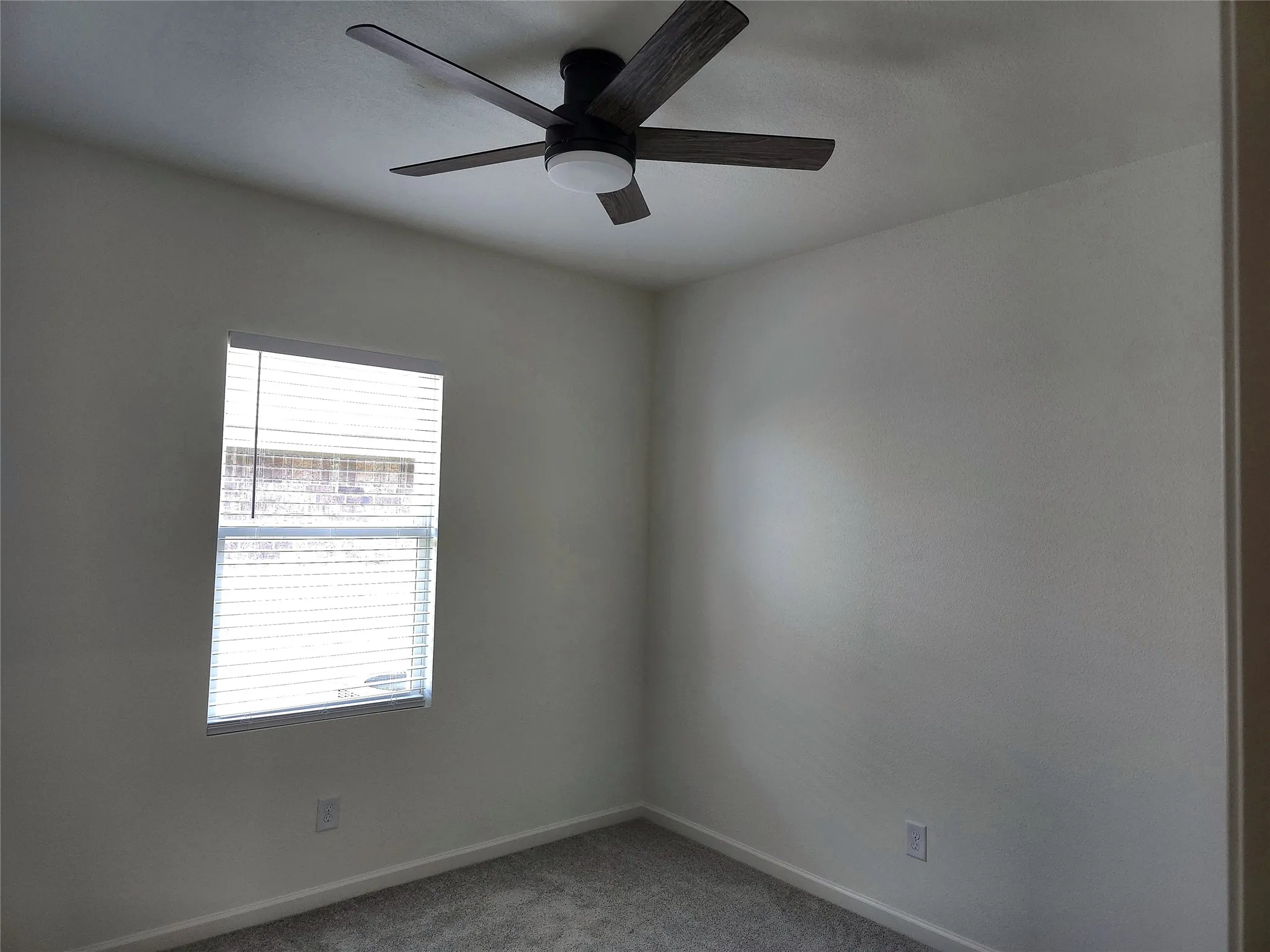 Recessed window with white blinds