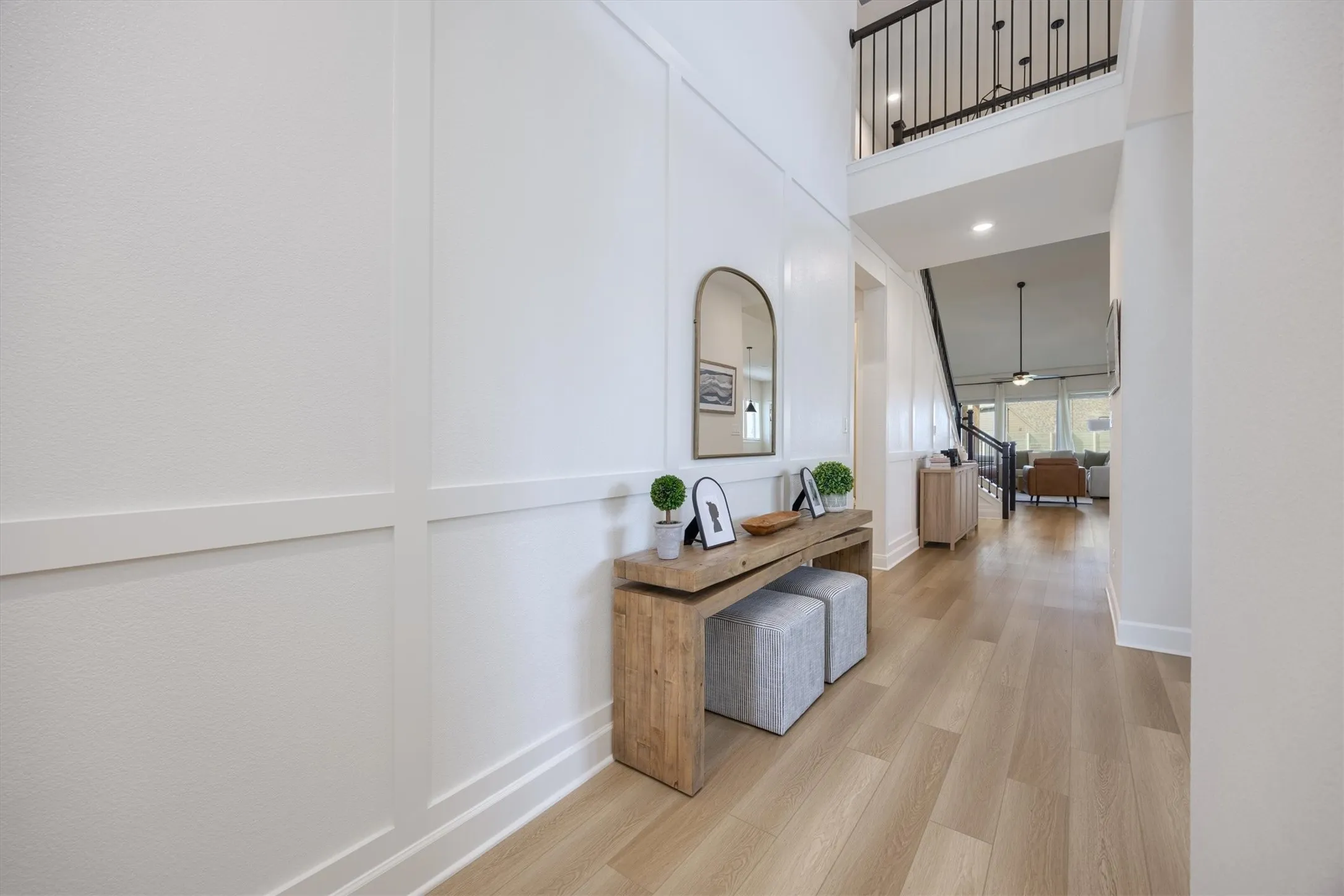 Notice the stunning natural colored wood floors and board and batten wall decor.