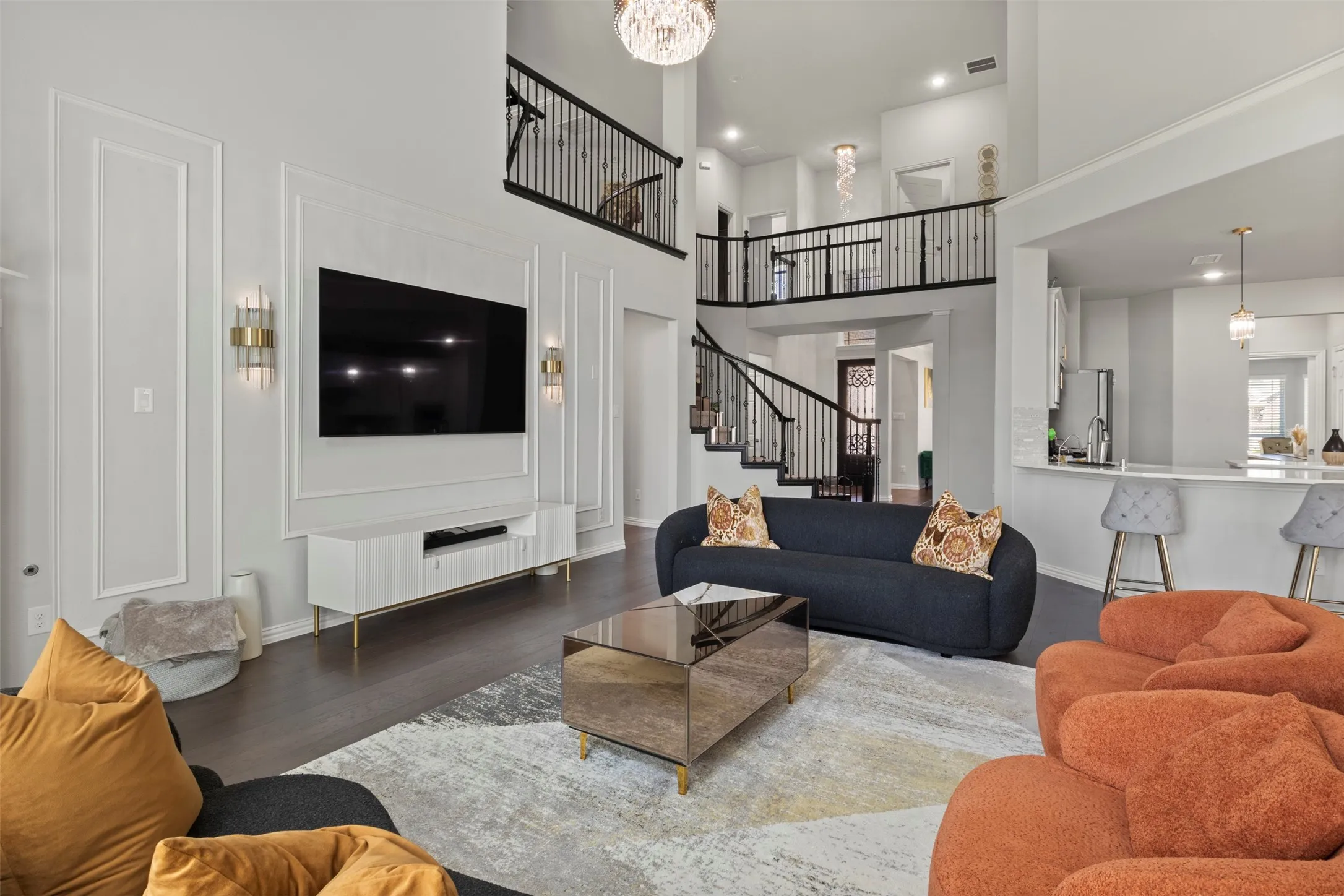 Soaring ceilings, elegant wainscoting, and wood-finish flooring