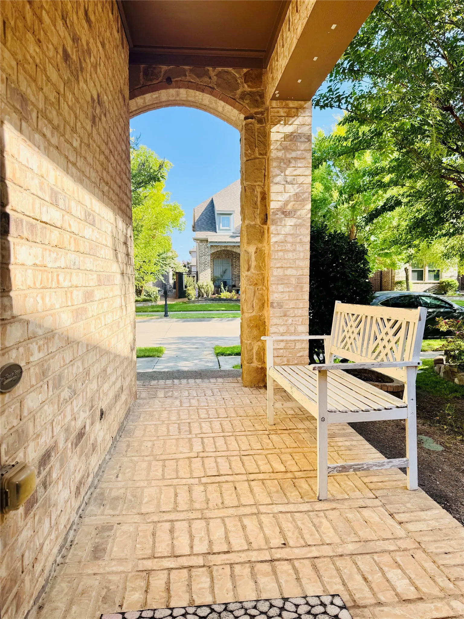 Brick and stone exterior with an arched entryway