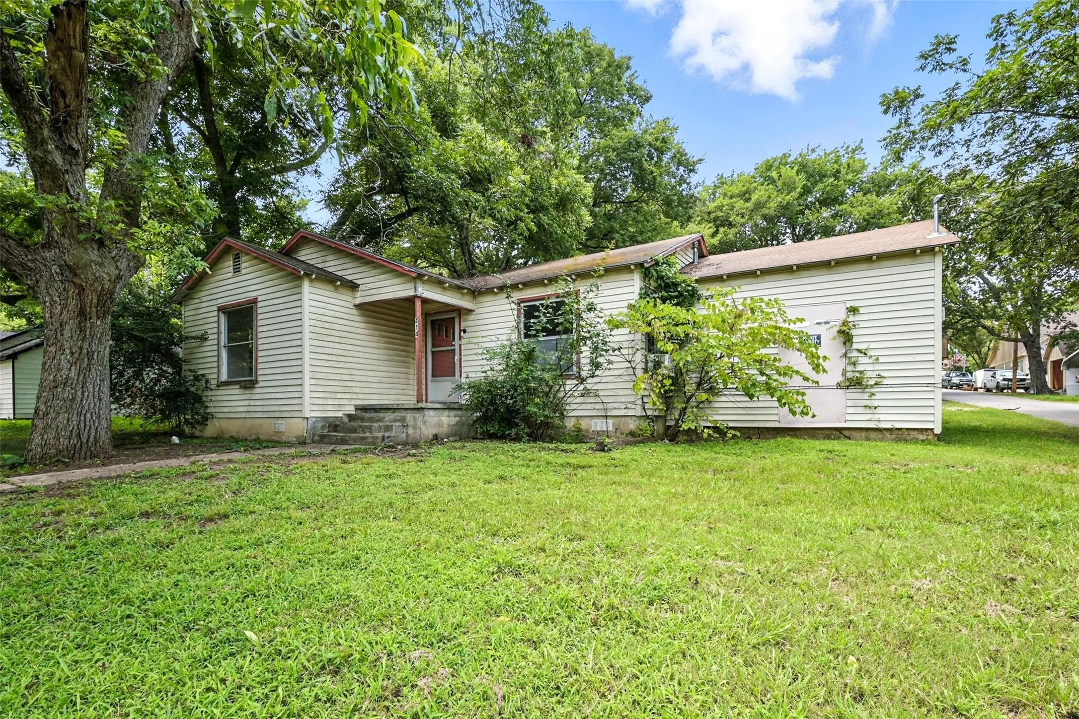 Single story home featuring a front lawn