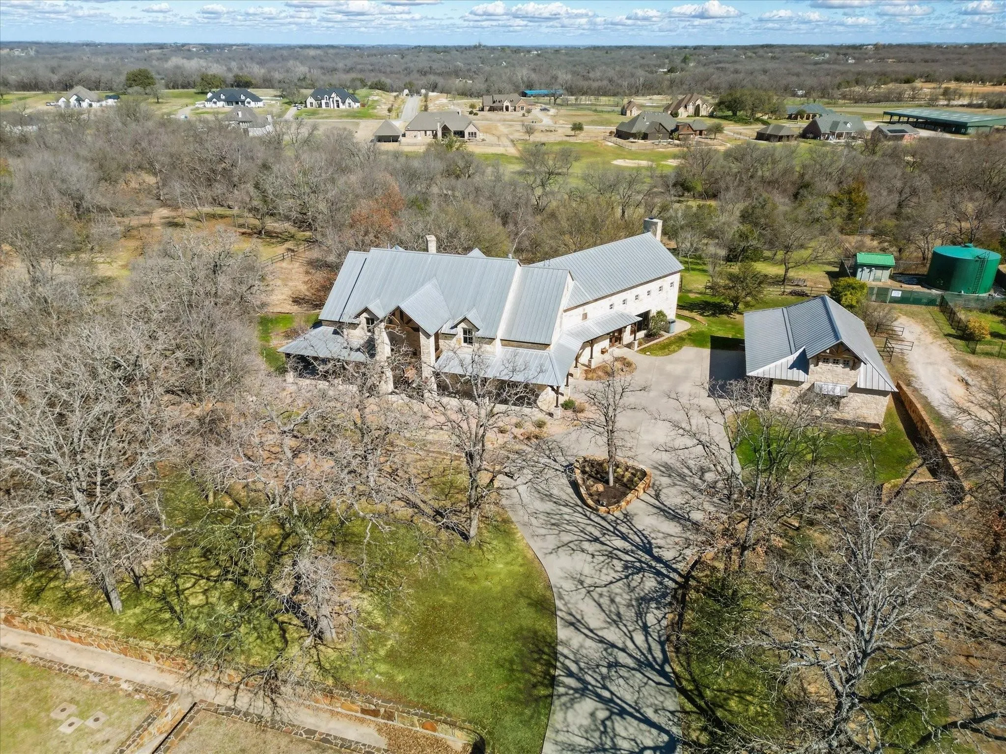 Aerial view of the property and surrounding landscape.