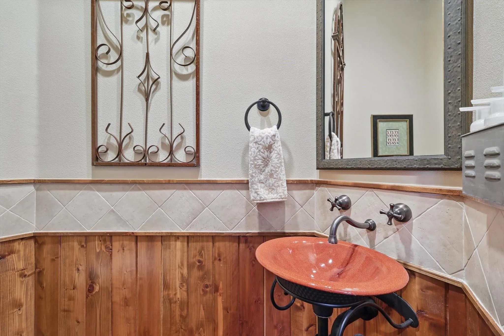 Bathroom with sink and textured wall.