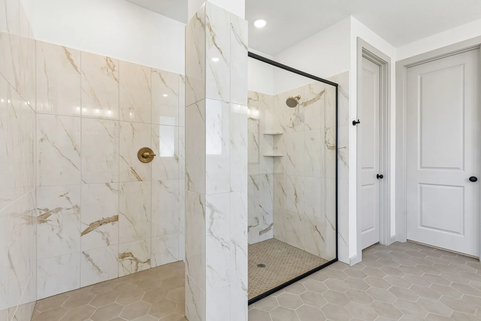 Offering a spacious walk in shower with drying area, you will never want to leave this dream owner's bath!