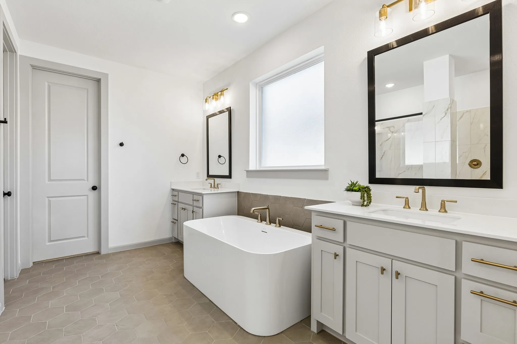Plenty of room for two int his beautiful owner's bath.