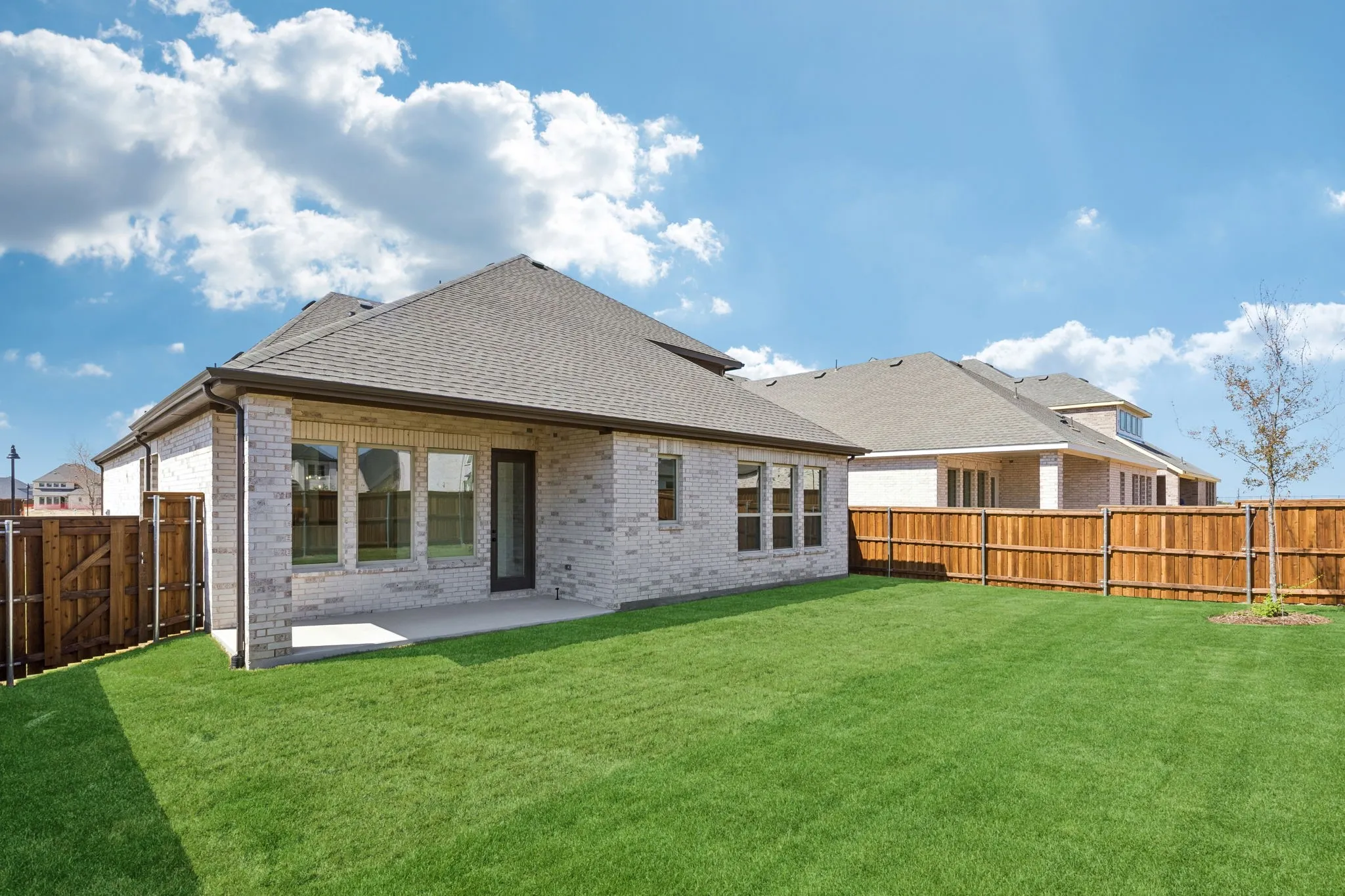 Plenty of outdoor family fun time to be had in this wonderful fenced back yard with covered patio!
