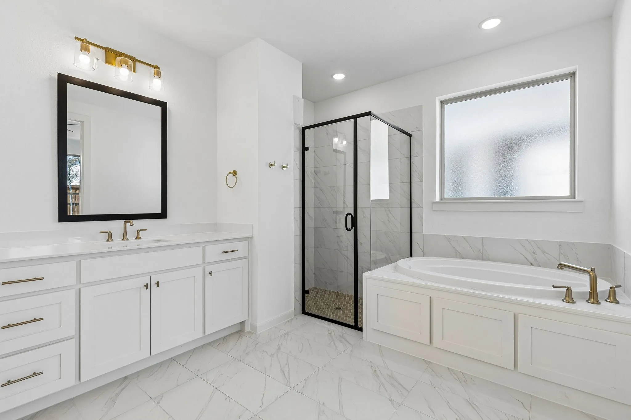 This fantastic owner's bath offers a spacious walk in shower combined with a wonderful soaking tub.