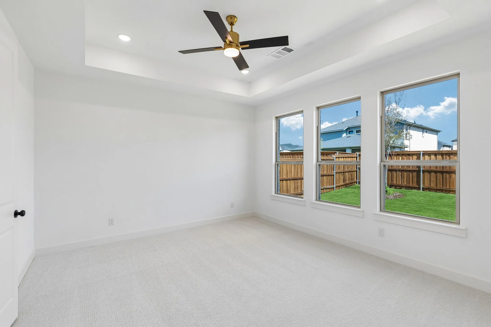 This peaceful light filled owner's bedroom is the perfect place to relax after a long day.