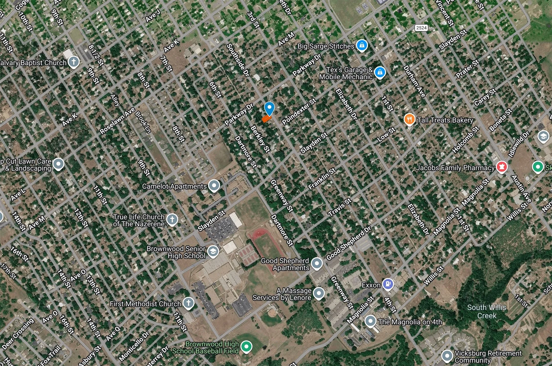 Aerial Map. Displaying a street grid with various identified locations and a highlighted property marker