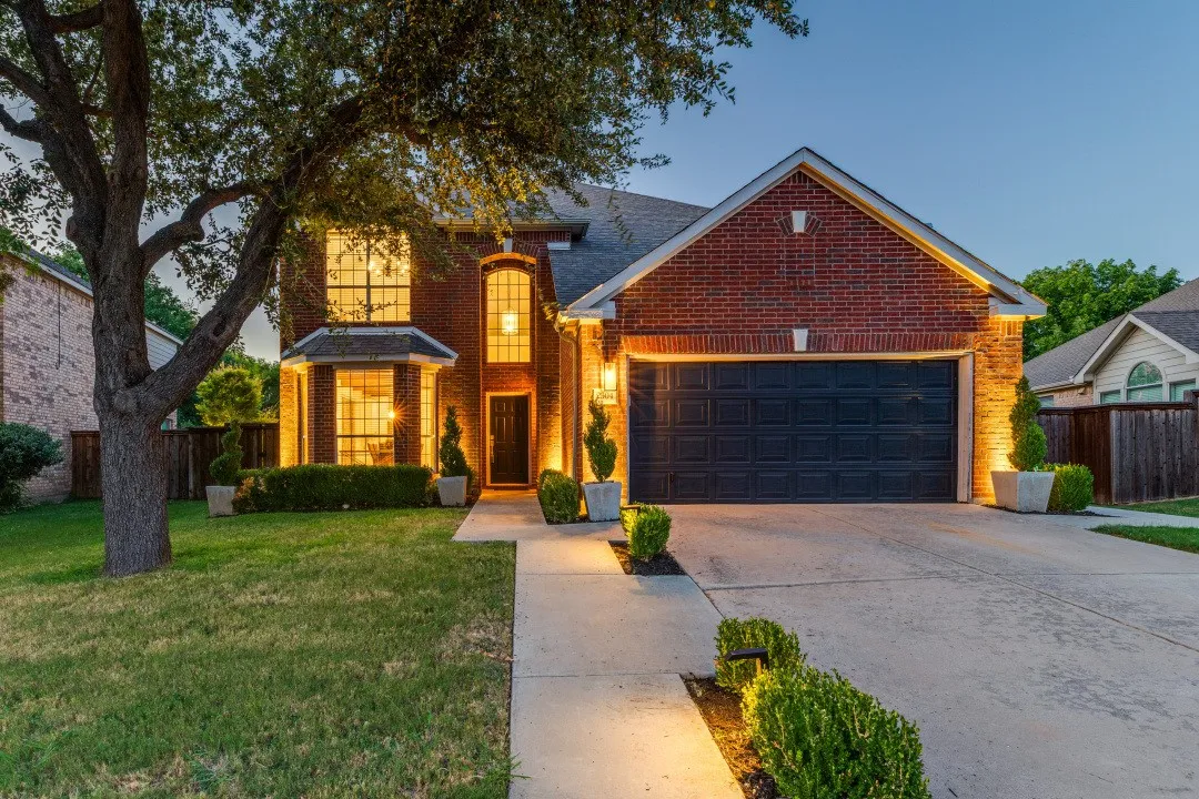Brick exterior with a prominent two-car garage
