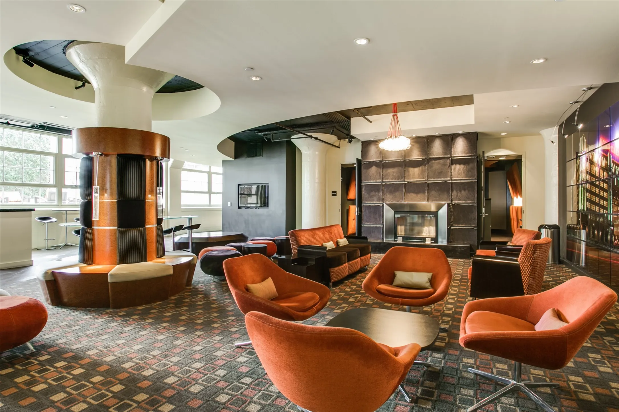 Lounge area on 3rd floor outside gym and media room. Recessed fireplace with dark paneled surround