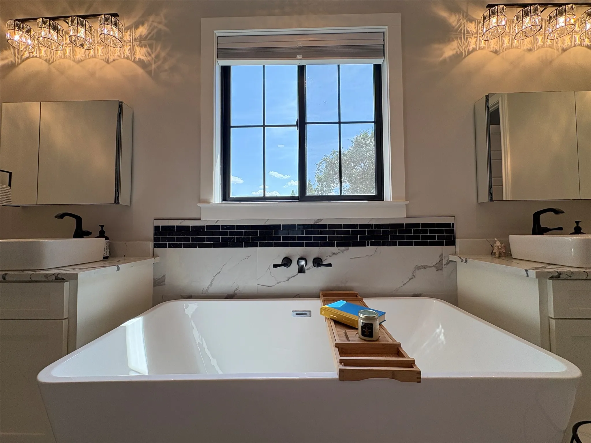 Elegant tub with modern bathroom finishes