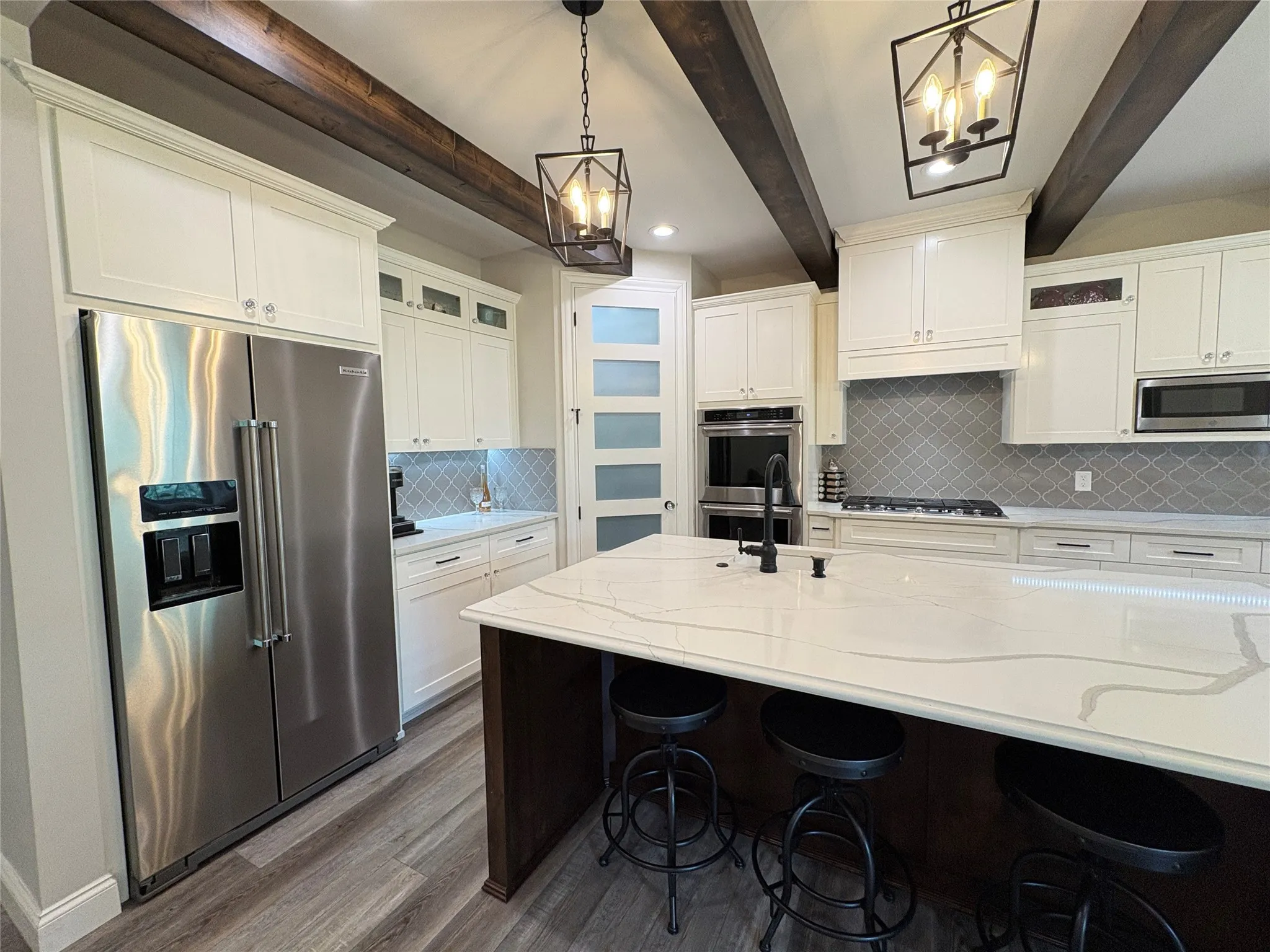 Quartz countertops and custom cabinetry through the lovely home